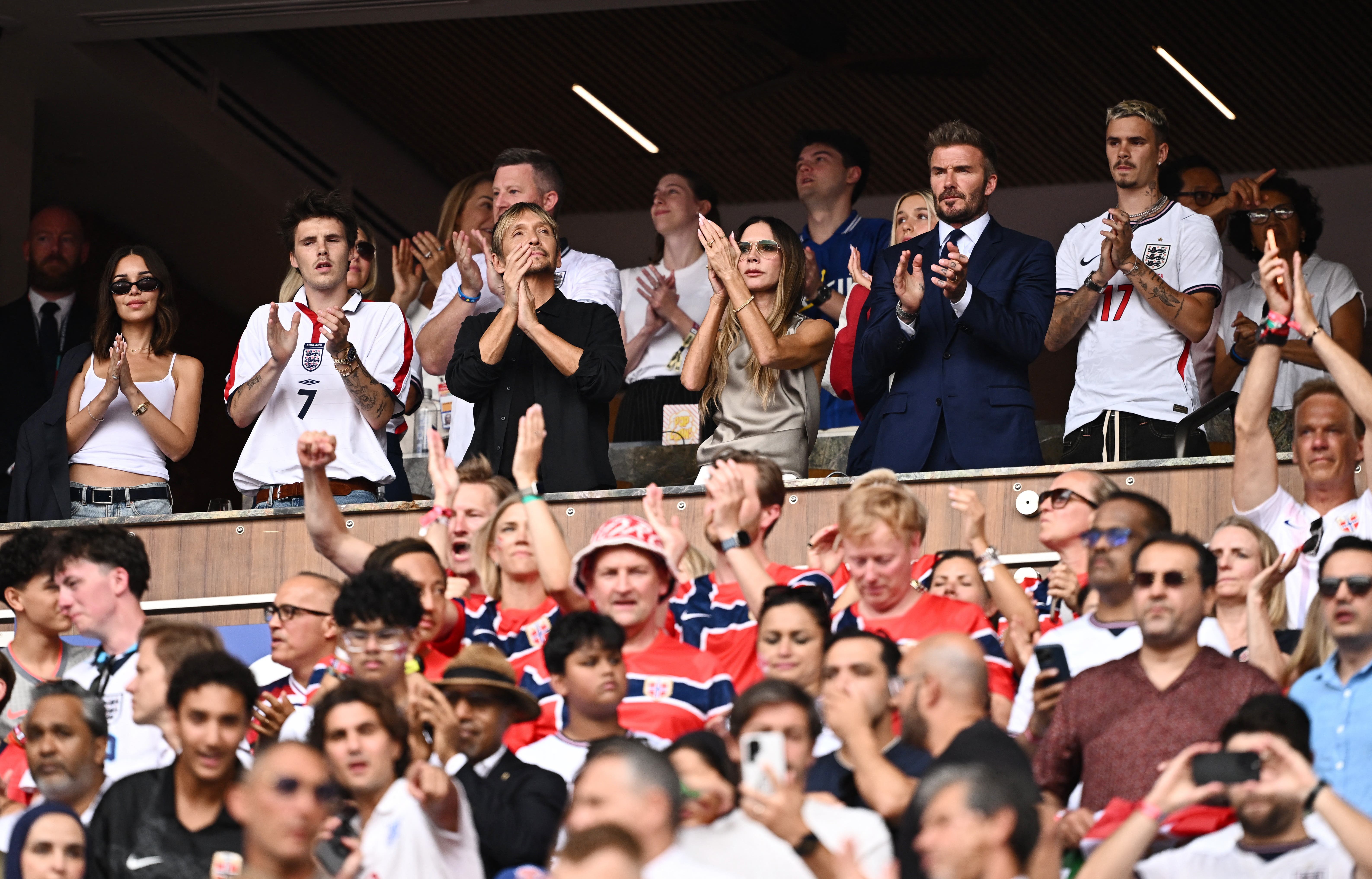 Soccer Football - FIFA World Cup 2026 - Quarter Final - Norway v England - Miami Stadium, Miami Gardens, Florida, U.S. - July 11, 2026 Inter Miami co-owner David Beckham, his wife Victoria and son Romeo in the stands before the match REUTERS/Dylan Martinez

