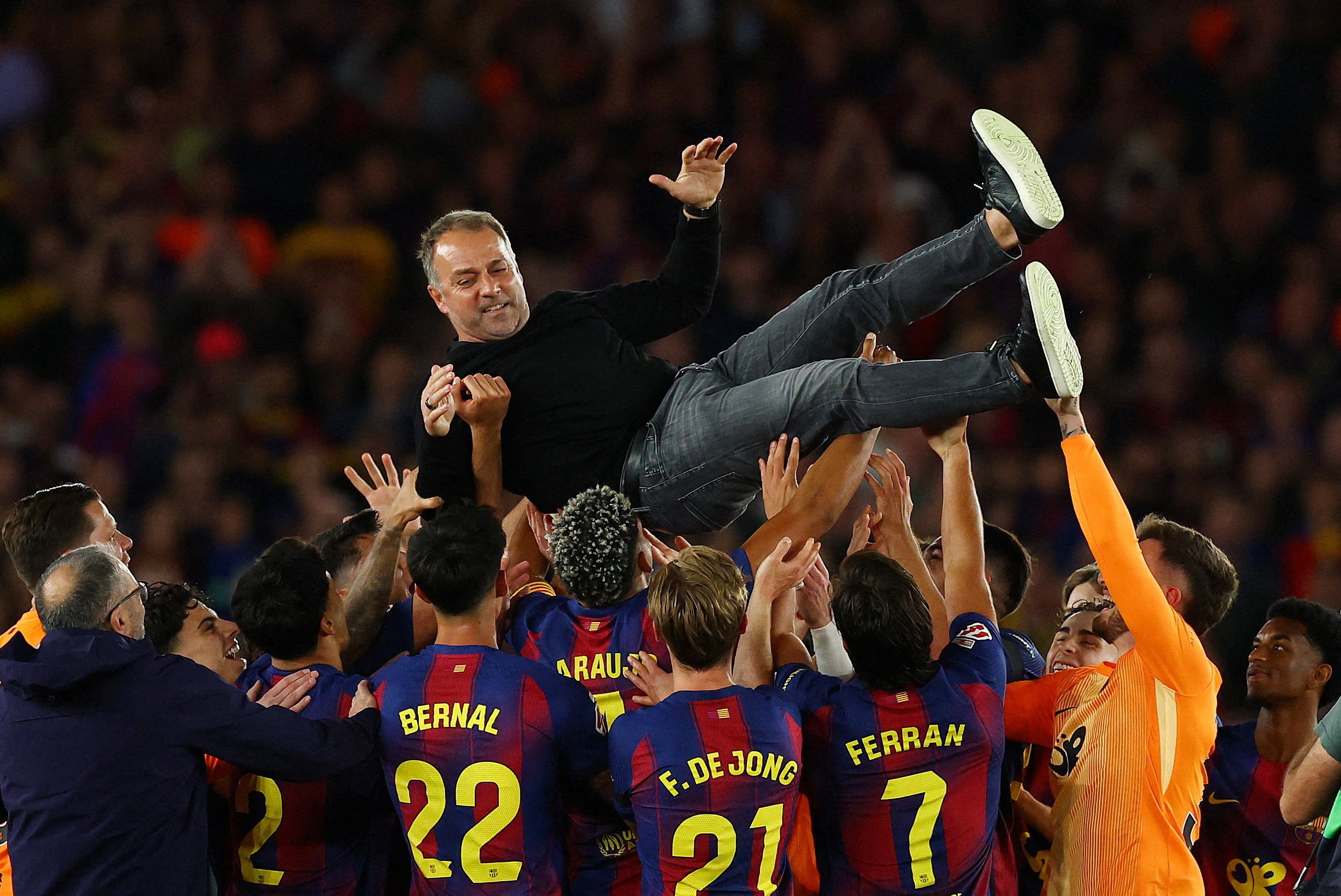 Soccer Football - LaLiga - FC Barcelona v Real Madrid - Spotify Camp Nou, Barcelona, Spain - May 10, 2026 FC Barcelona players throw coach Hansi Flick in the air as they celebrate after winning the LaLiga REUTERS/Albert Gea TPX IMAGES OF THE DAY