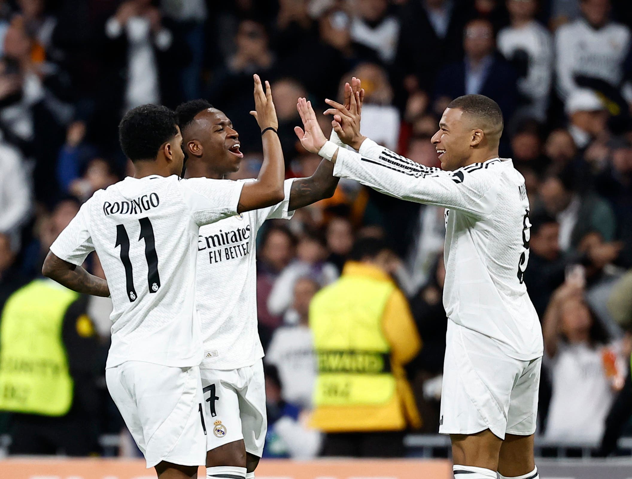 Real Madrid's Kylian Mbappe celebrates scoring their third goal with Vinicius Junior and Rodrygo