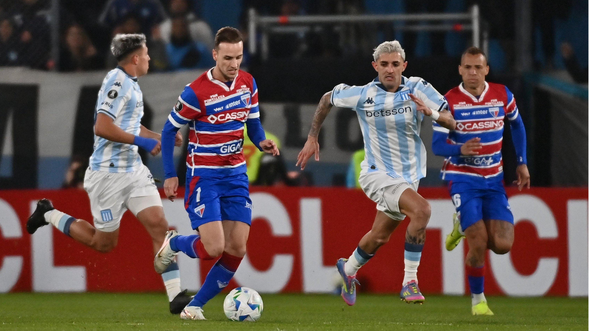 Racing and Fortaleza players battle for the ball at the Sudamericana