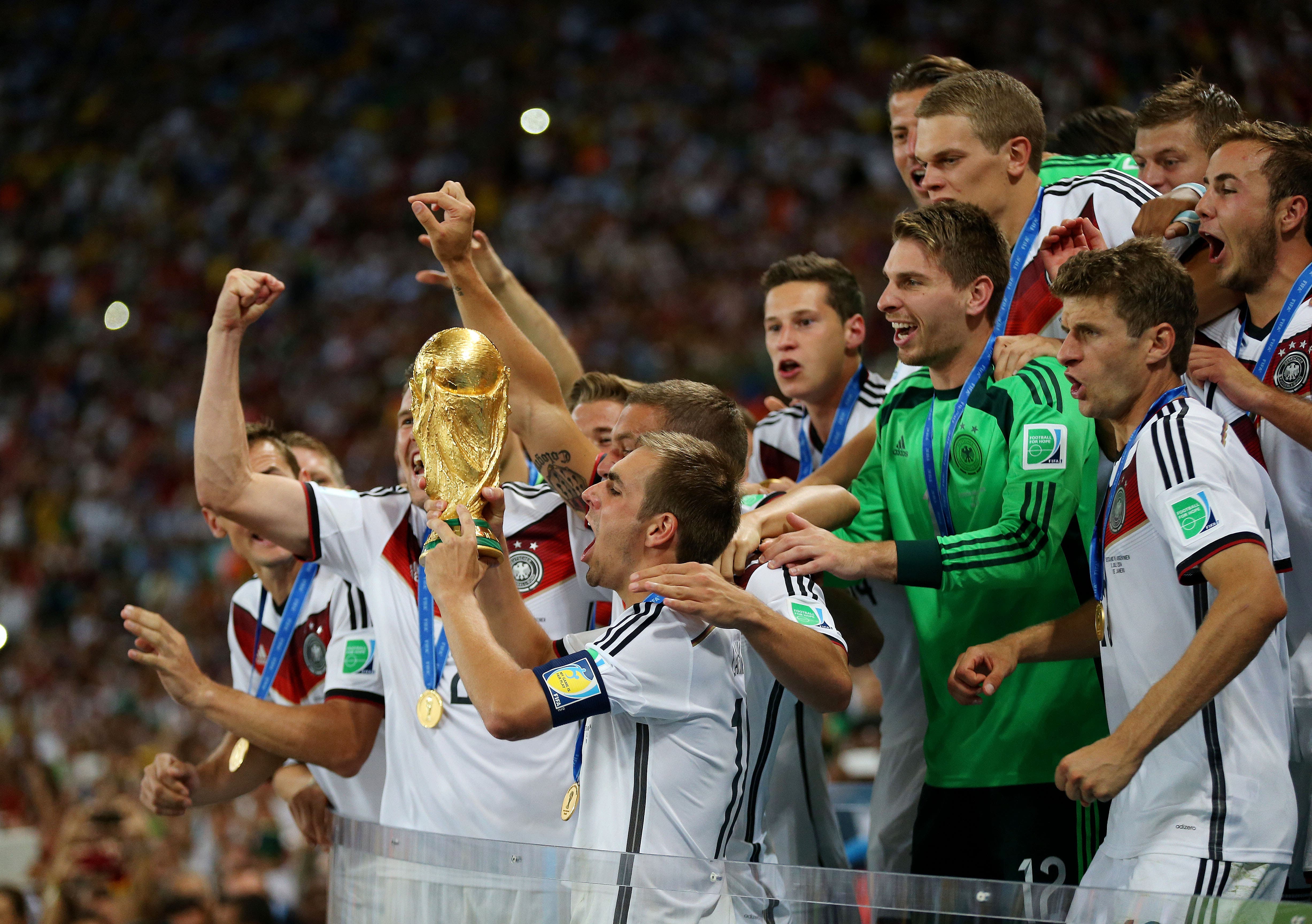Football - Germany v Argentina - FIFA World Cup Brazil 2014 - Final - Estadio do Maracana, Rio de Janeiro, Brazil - 13/7/14 Germany celebrates winning the World Cup with the trophy Mandatory Credit: Action Images / Matthew Childs Livepic EDITORIAL USE ONLY.
