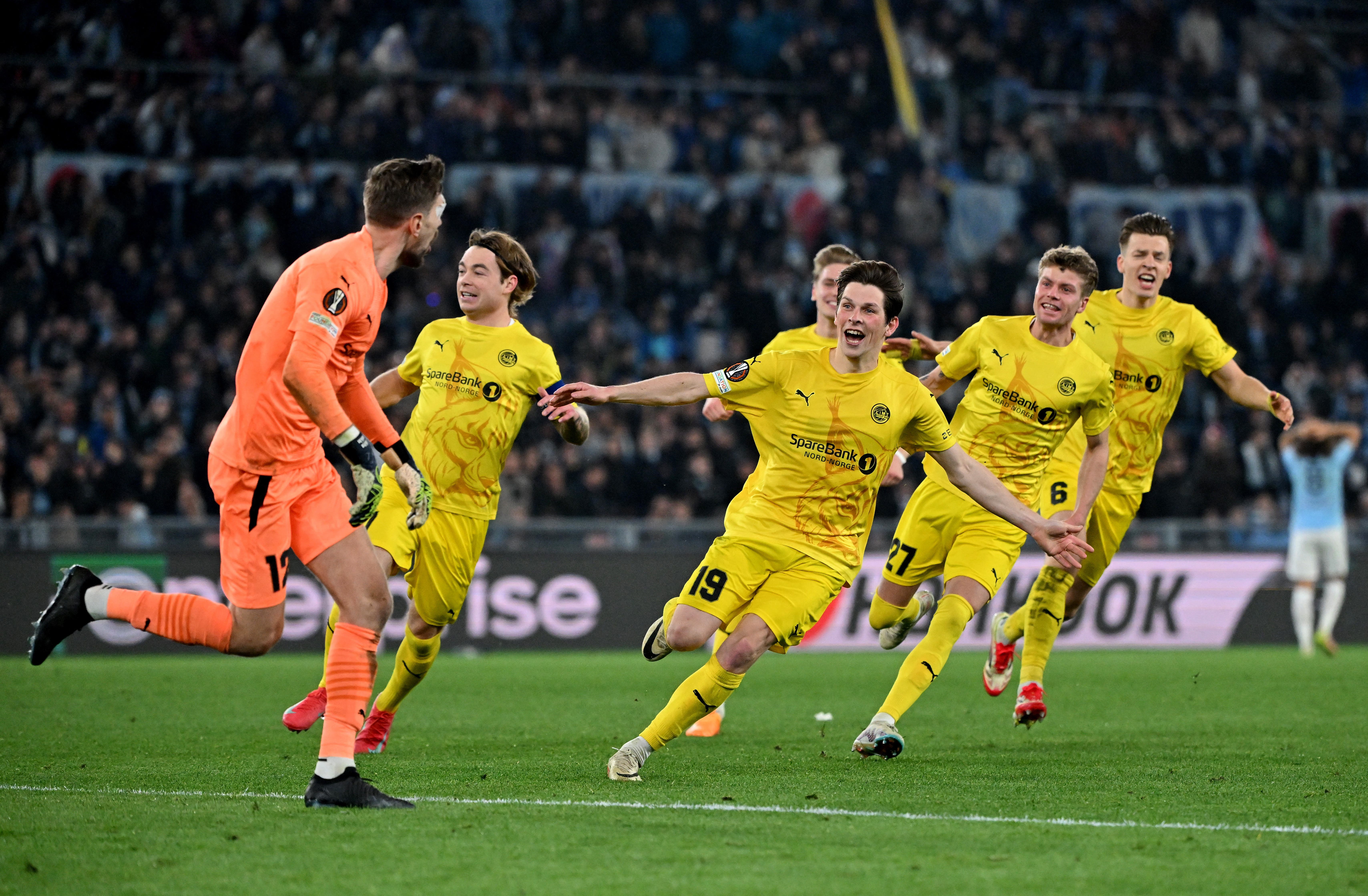 Bodo/Glimt's Nikita Haykin, Bodo/Glimt's Patrick Berg and Bodo/Glimt's Sondre Brunstad Fet celebrate after winning the penalty shootout 