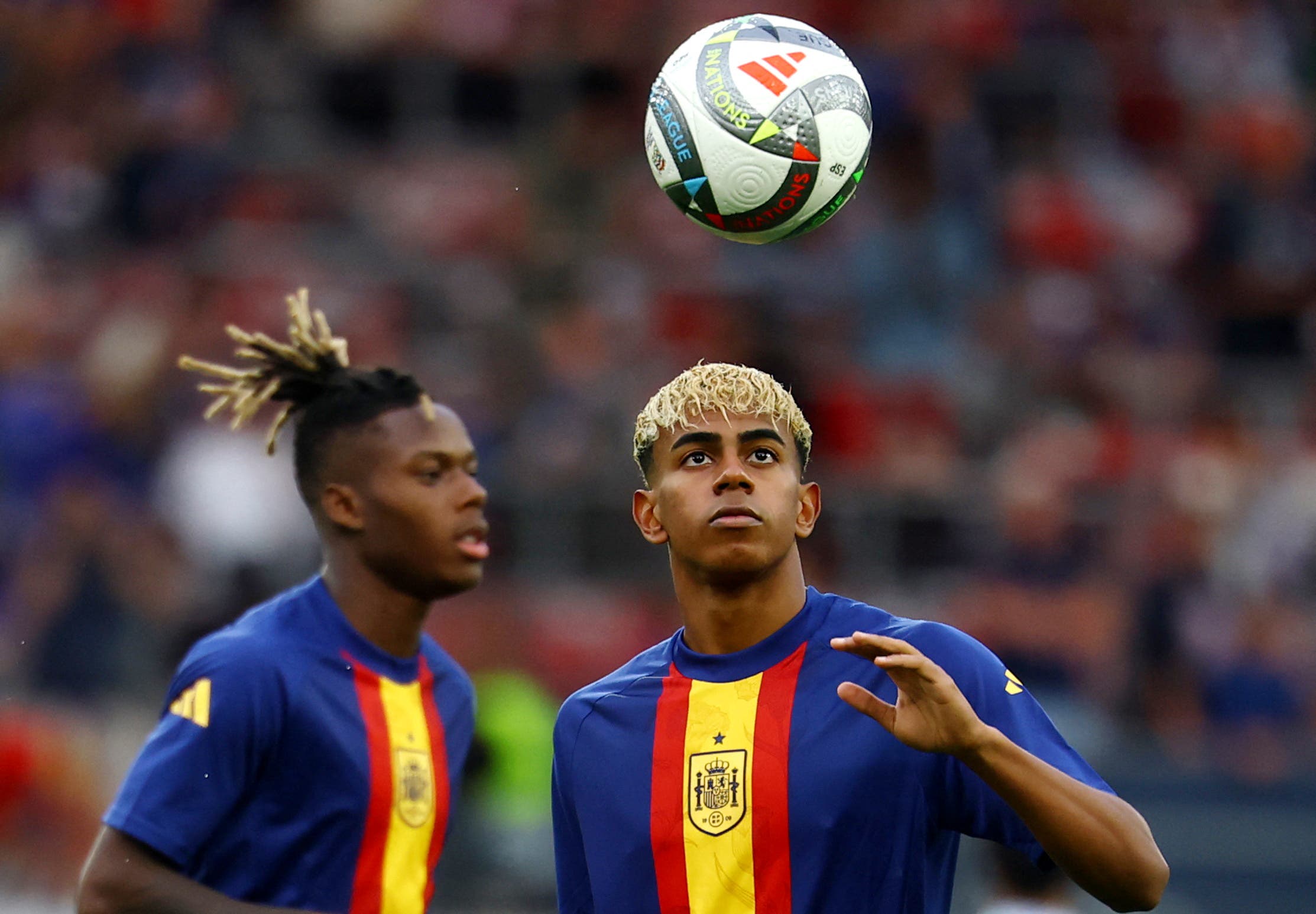 Spain's Lamine Yamal during the warm up before the match