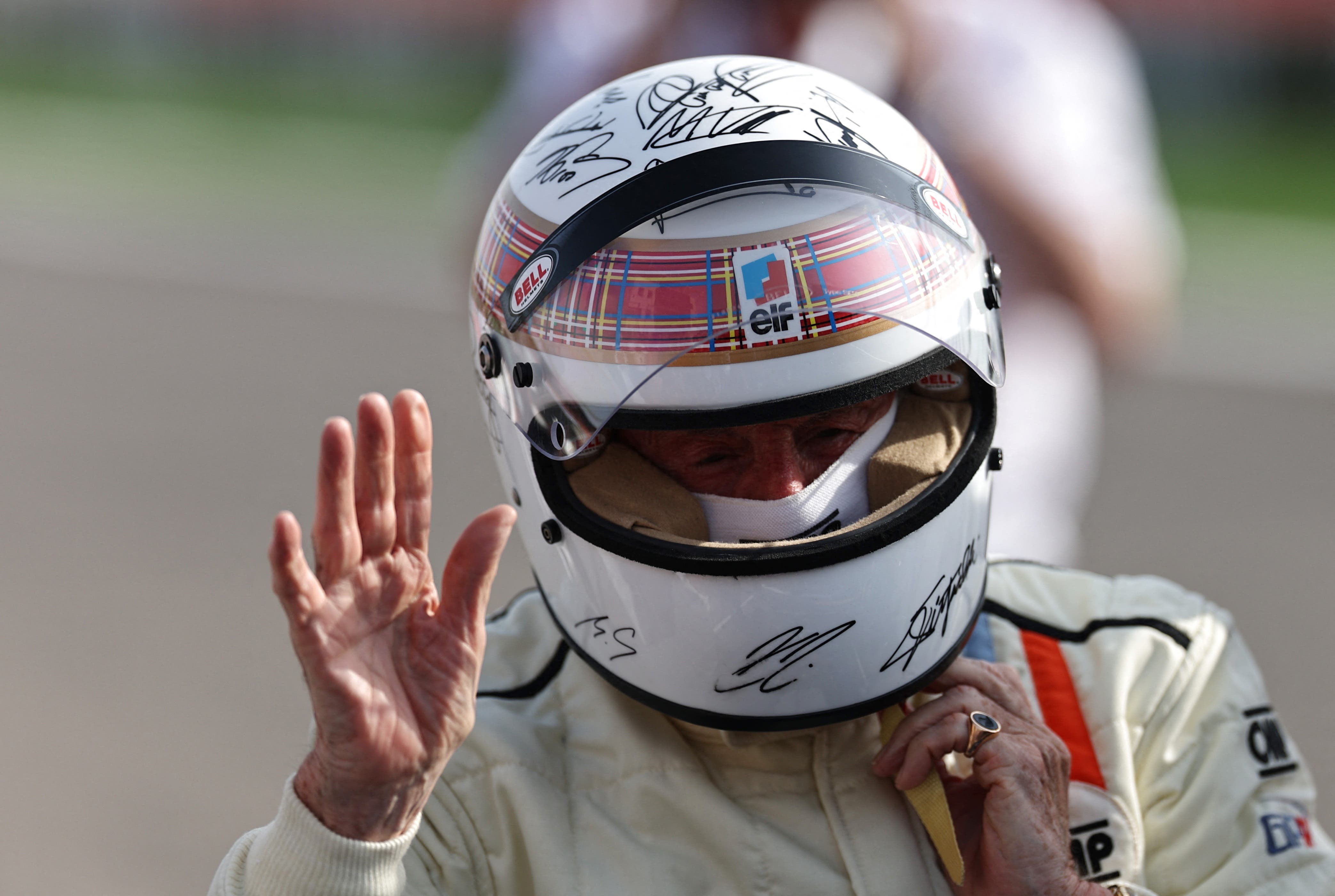  Jackie Stewart is pictured wearing a helmet to be auctioned off to raise funds for Sir Jackie Stewart's Race Against Dementia charity after driving his 1973 title-winning Tyrrell ahead of the Bahrain Grand Prix 
