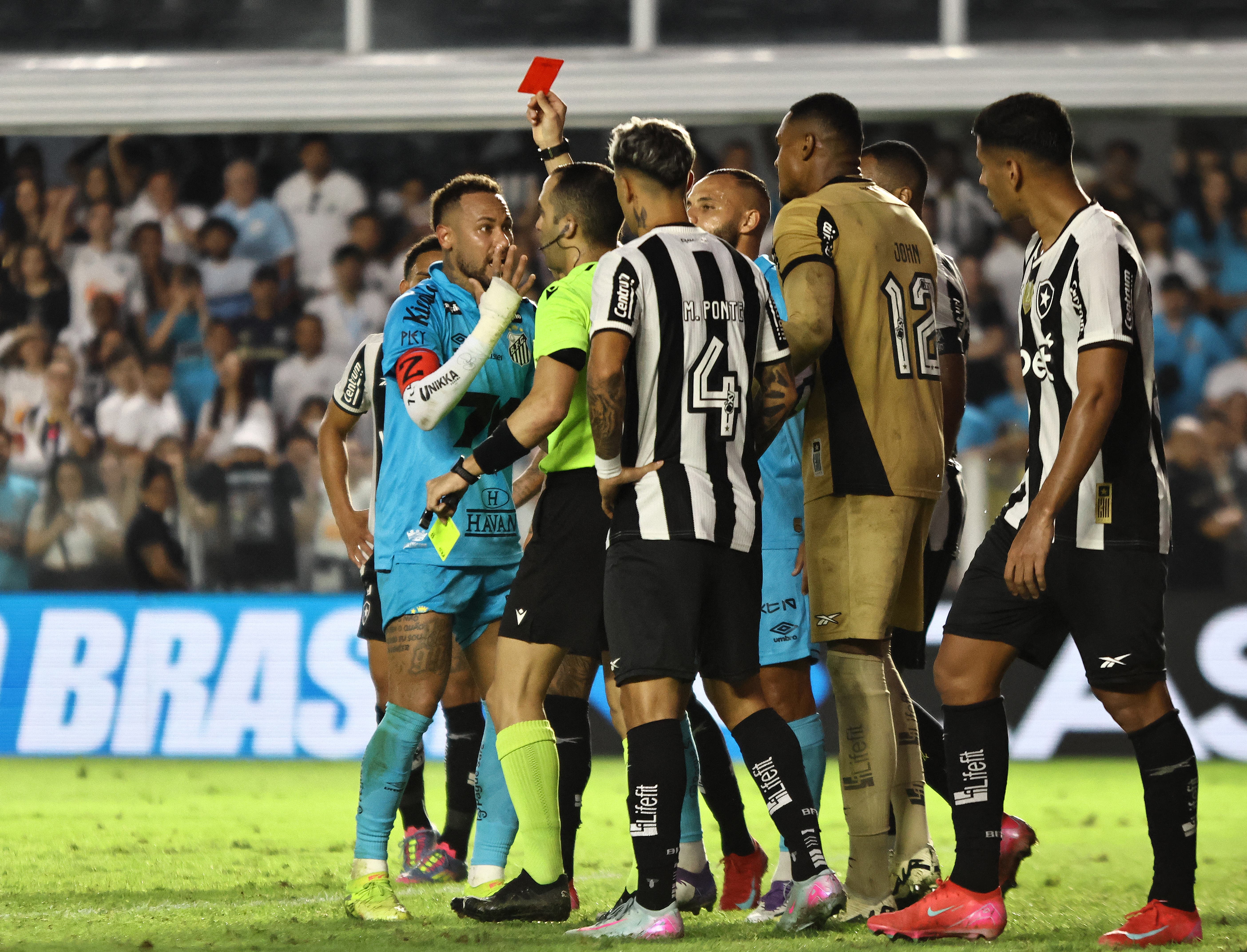 Santos' Neymar is shown a red card by referee Davi De Oliveira Lacerda