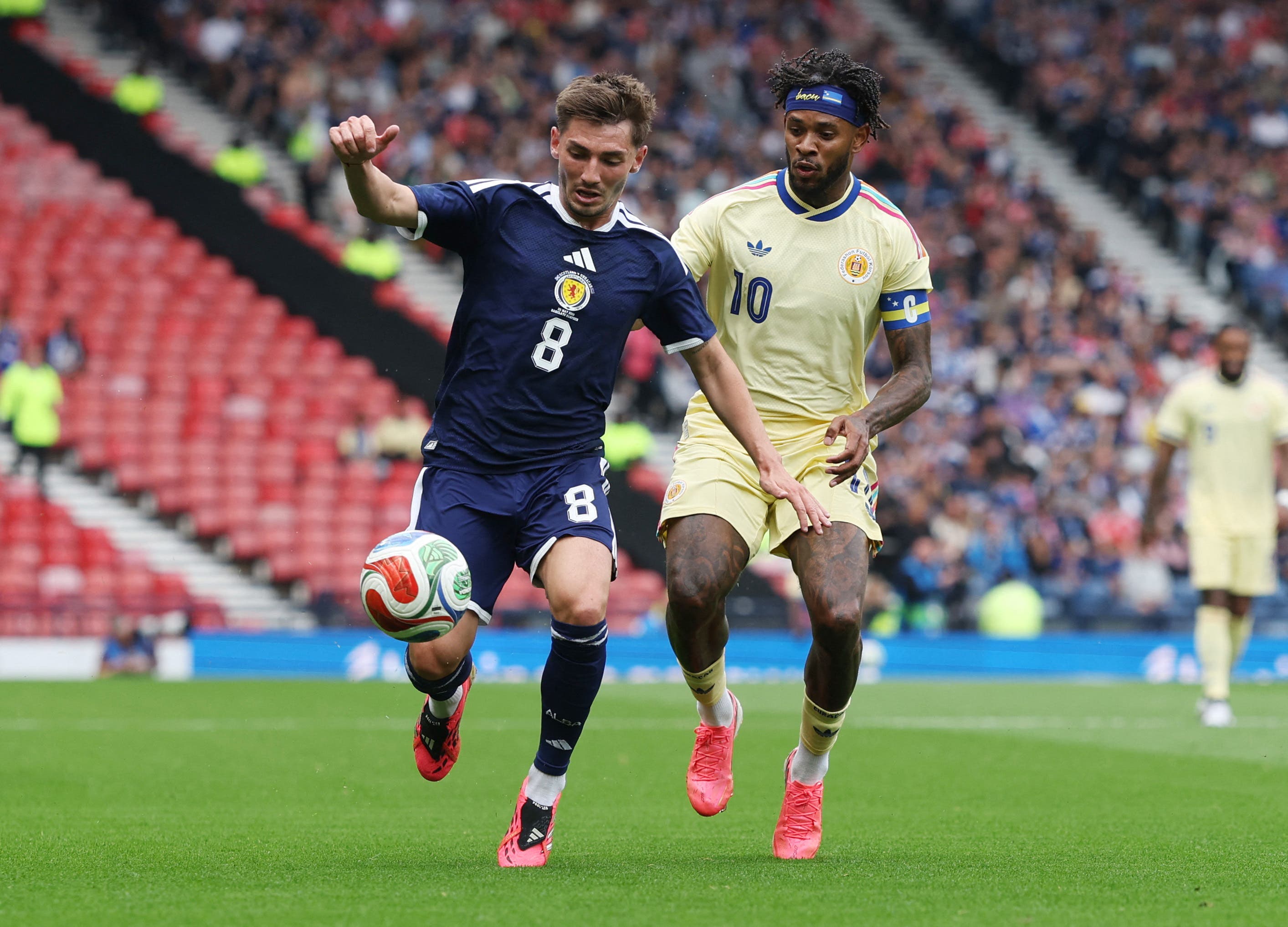 Soccer Football - International Friendly - Scotland v Curacao - Hampden Park, Glasgow, Scotland, Britain - May 30, 2026 Scotland's Billy Gilmour in action with Curacao's Leandro Bacuna REUTERS/Russell Cheyne
