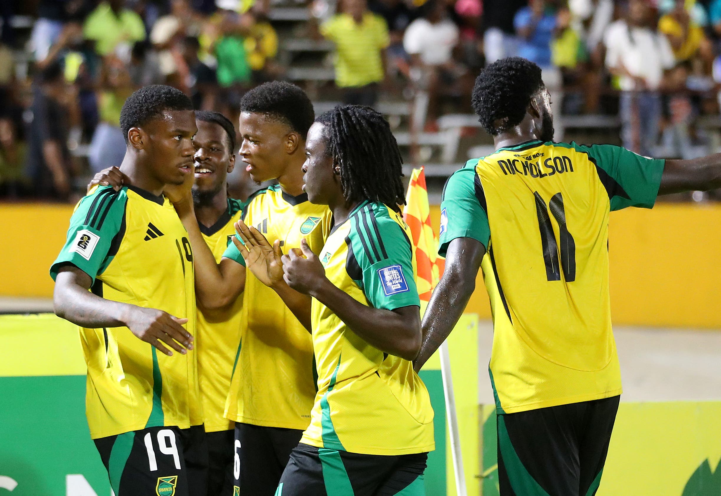 Soccer Football - FIFA World Cup - CONCACAF Qualifiers - Group B - Jamaica v Bermuda - National Stadium Independence Park, Kingston, Jamaica - October 14, 2025 Jamaica's Dujuan Richards celebrates scoring their fourth goal with teammates REUTERS/Gilbert Bellamy