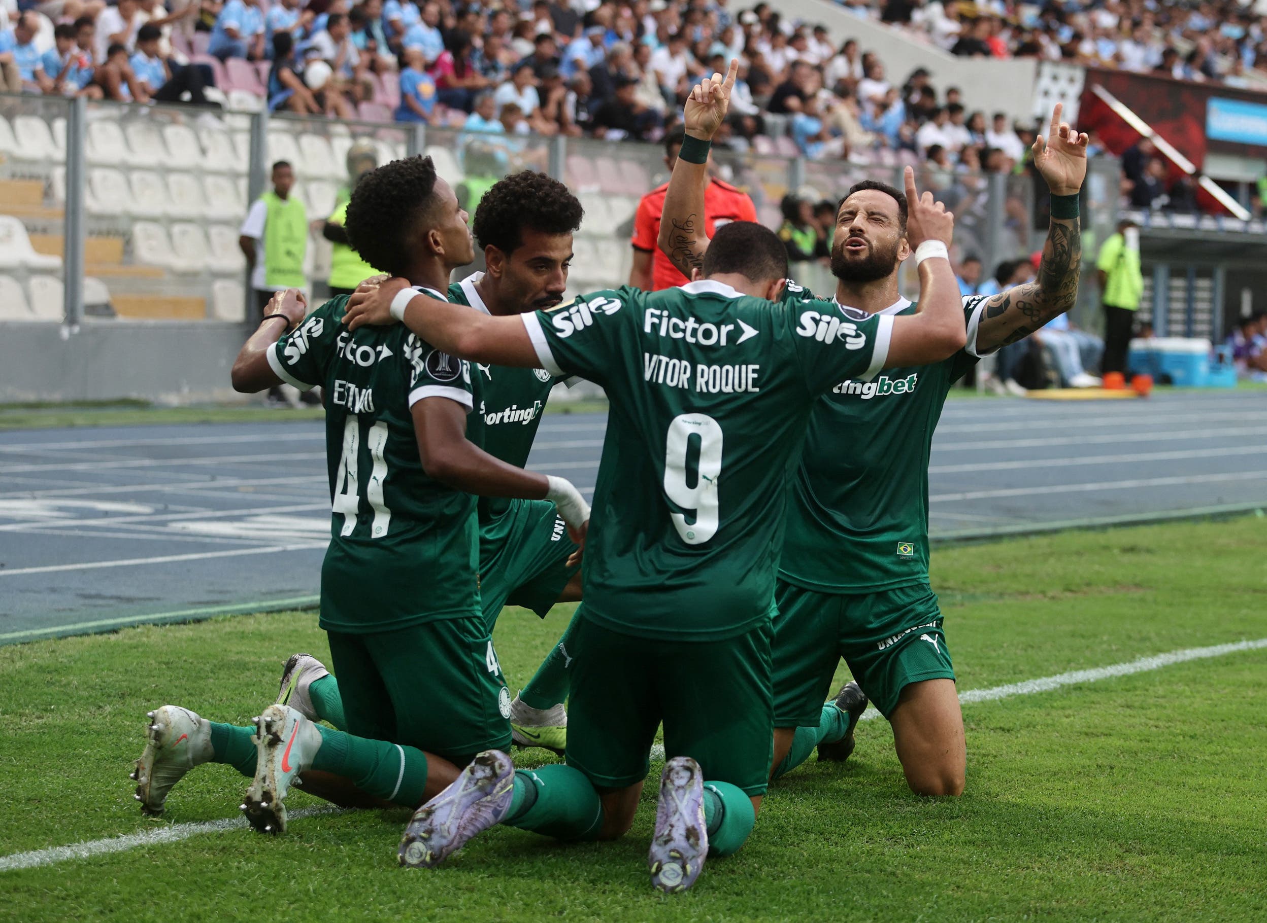 Palmeiras' Estevao Willian celebrates scoring their first goal with teammates