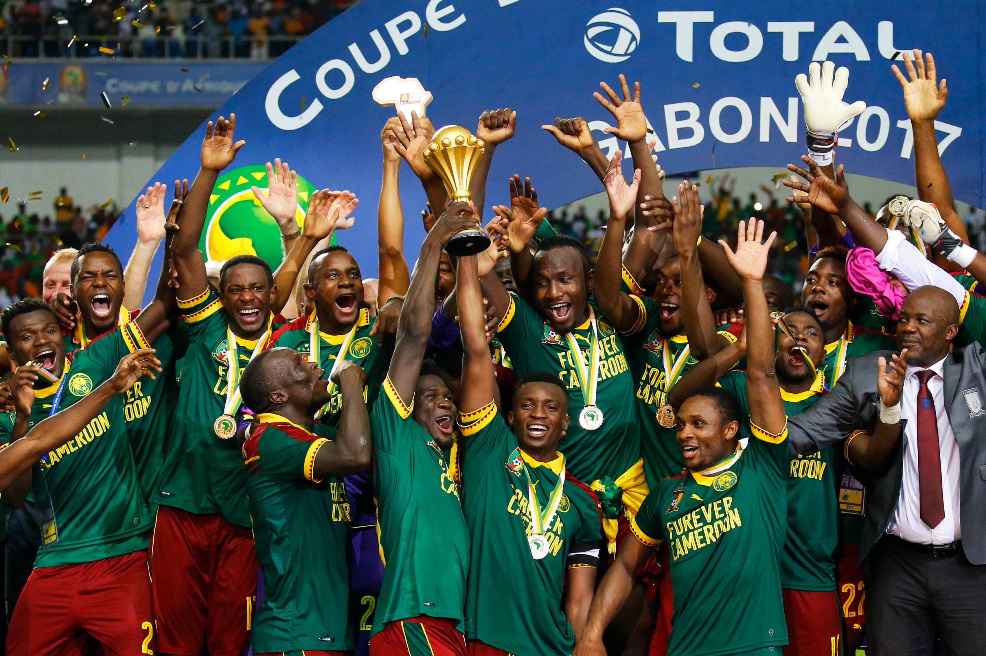 Football Soccer - African Cup of Nations - Final - Egypt v Cameroon - Stade d'Angondjé - Libreville, Gabon - 5/2/17 Cameroon's Benjamin Moukandjo celebrates with the trophy and teammates after winning the African Cup of Nations Reuters / Mike Hutchings Livepic
