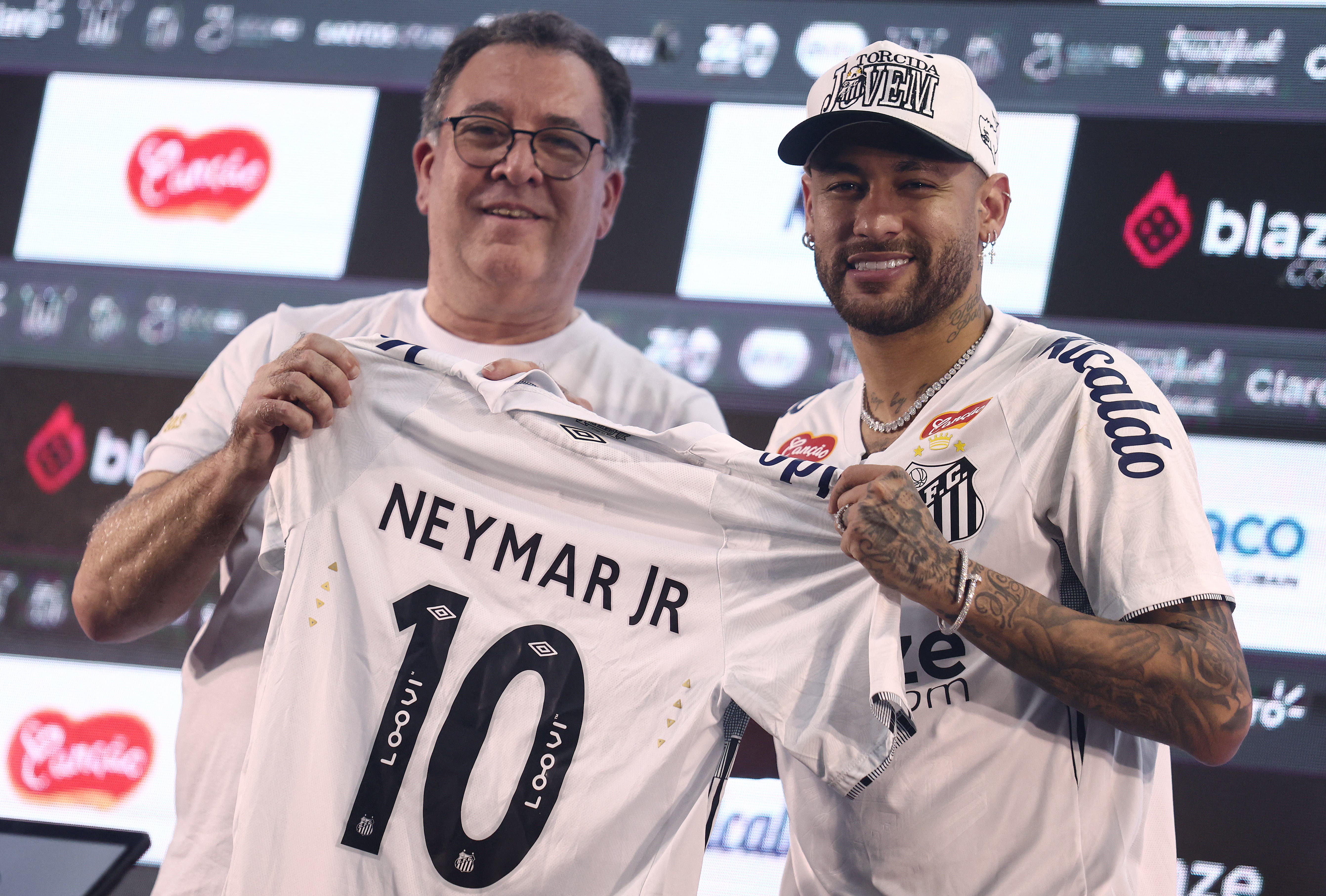 Neymar Jr poses with his new Jersey number with Santos FC President