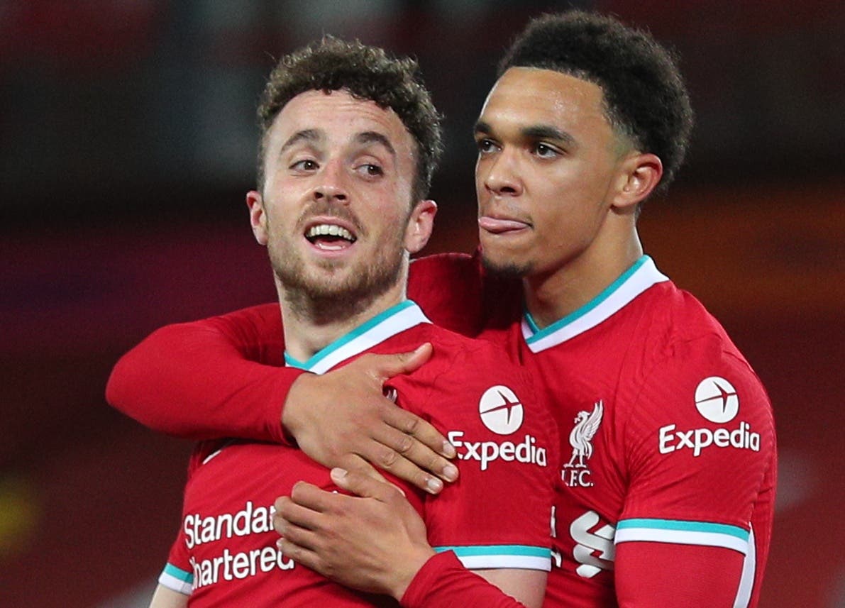 Soccer Football - Premier League - Liverpool v Sheffield United - Anfield, Liverpool, Britain - October 24, 2020 Liverpool's Diogo Jota celebrates scoring their second goal with Trent Alexander-Arnold Pool via REUTERS/Peter Byrne 