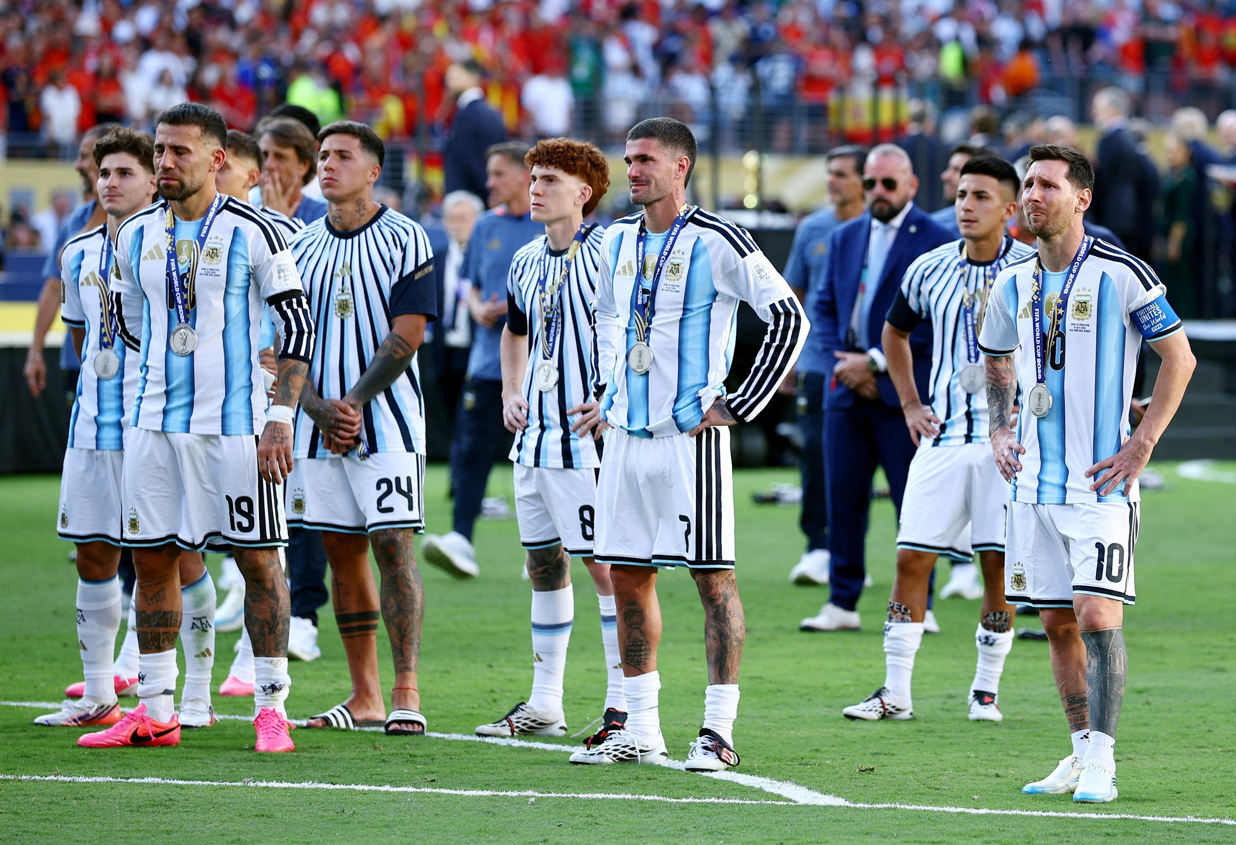 Soccer Football - FIFA World Cup 2026 - Final - Spain v Argentina - New York/New Jersey Stadium, East Rutherford, New Jersey, U.S. - July 19, 2026 Argentina's Lionel Messi, Nicolas Otamendi, Rodrigo De Paul and Enzo Fernandez look dejected with teammates after losing the World Cup final REUTERS/Agustin Marcarian TPX IMAGES OF THE DAY