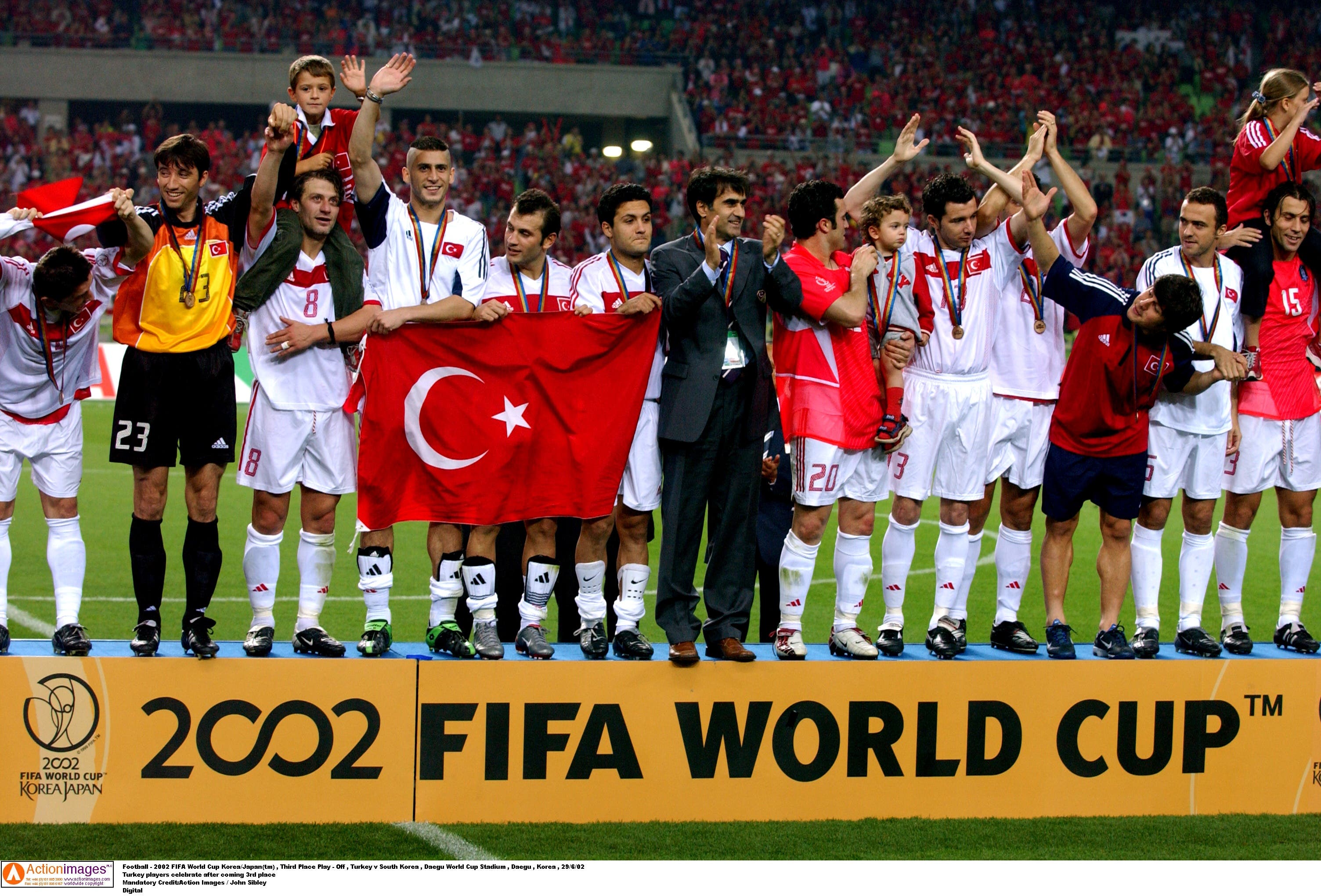 Football - 2002 FIFA World Cup Korea/Japan(tm) , Third Place Play - Off , Turkey v South Korea , Daegu World Cup Stadium , Daegu , Korea , 29/6/02 Turkey players celebrate after coming 3rd place Mandatory Credit:Action Images / John Sibley Digital