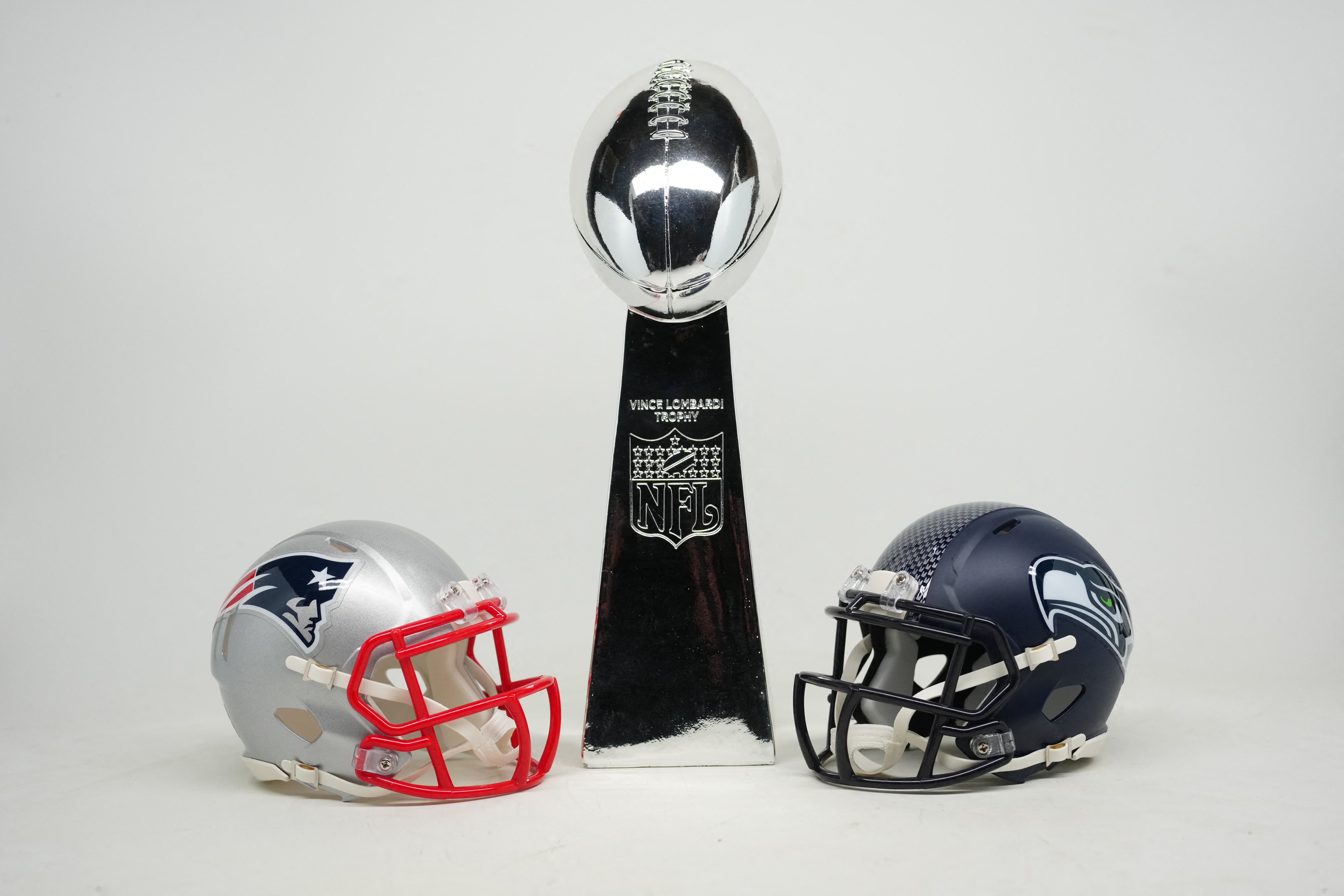 Jan 29, 2026; Santa Clara, California, USA; New England Patriots and Seattle Seahawks helmets with Super Bowl Vince Lombardi trophy. Mandatory Credit: Kirby Lee-Imagn Images