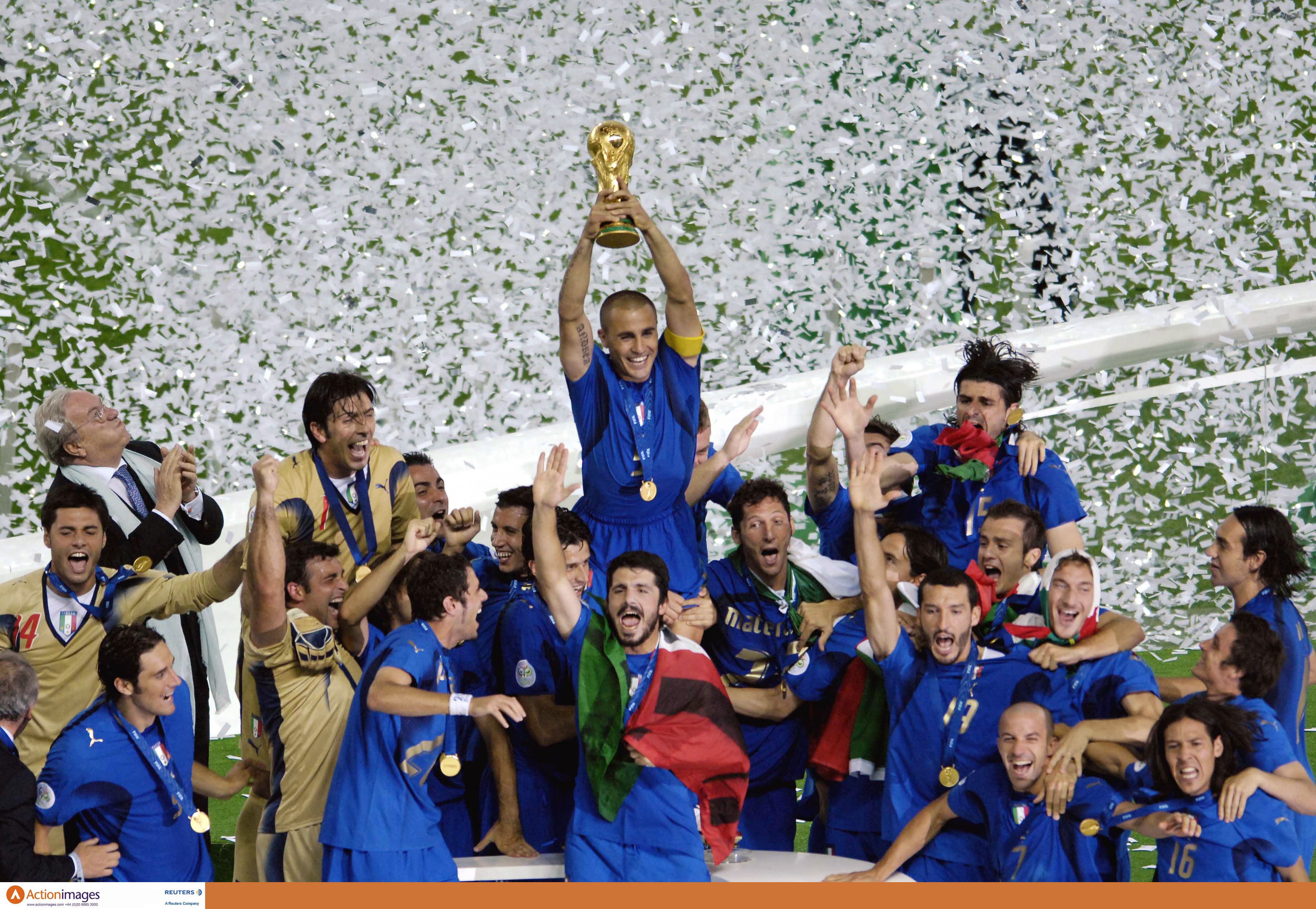 Football - Italy v France 2006 FIFA World Cup Final - Germany - Olympic Stadium, Berlin - 9/7/06 Italy's captain Fabio Cannavaro lifts the World Cup as he celebrates victory with his team mates Mandatory Credit: Action Images / Tony O'Brien Livepic