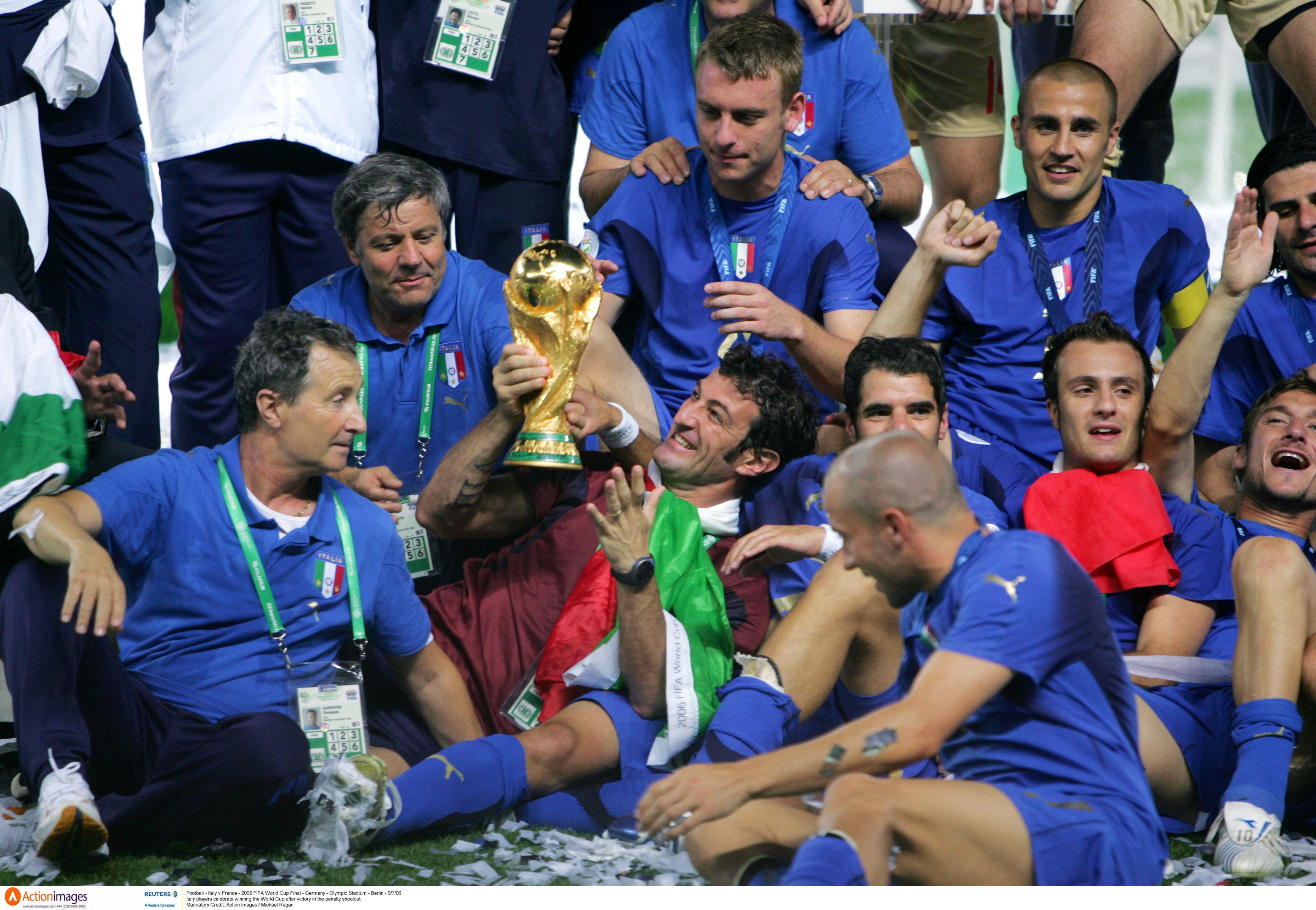 Football - Italy v France - 2006 FIFA World Cup Final - Germany - Olympic Stadium - Berlin - 9/7/06 Italy players celebrate winning the World Cup after victory in the penalty shootout Mandatory Credit: Action Images / Michael Regan