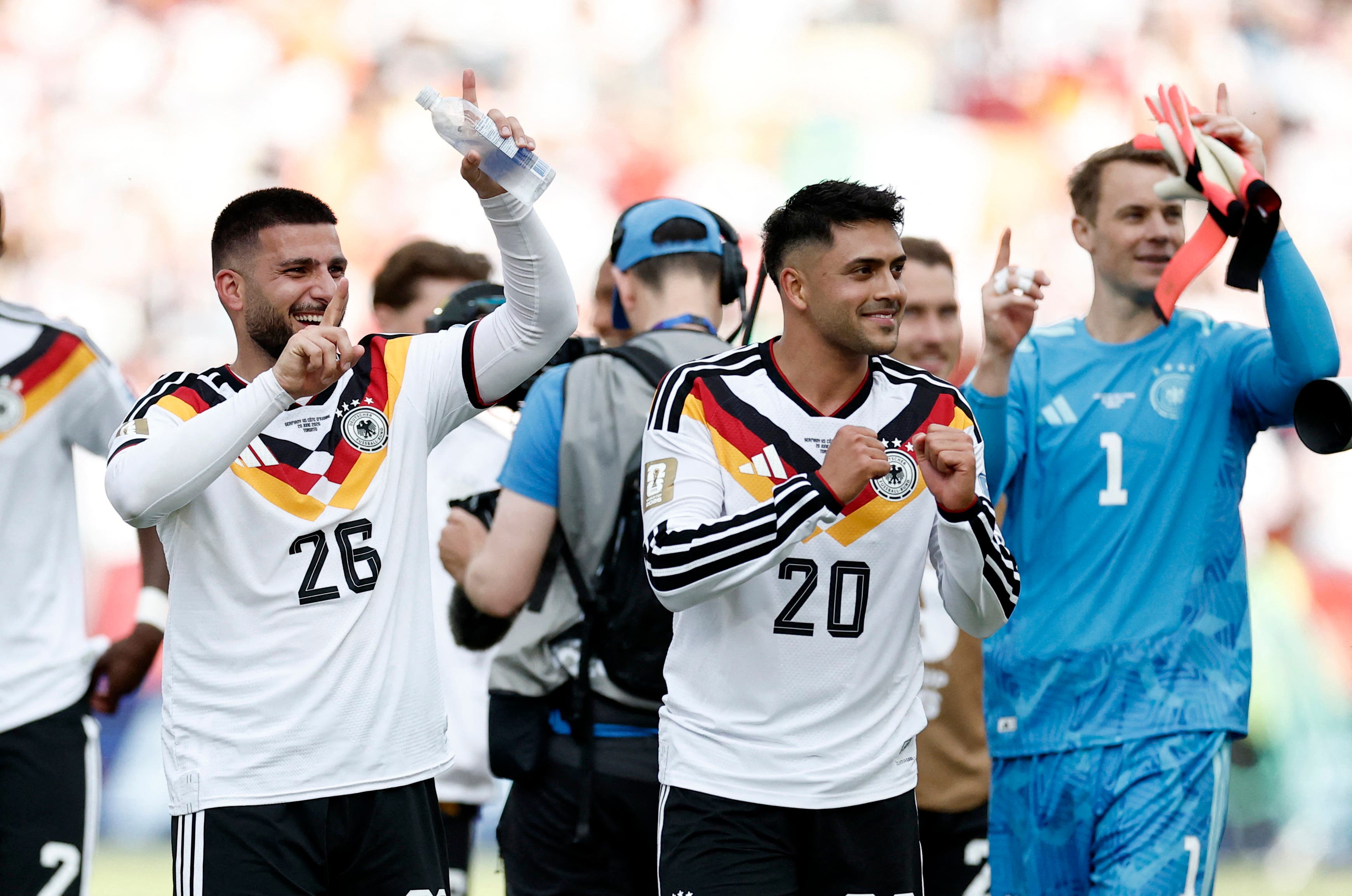 Soccer Football - FIFA World Cup 2026 - Group E - Germany v Ivory Coast - Toronto Stadium, Toronto, Canada - June 20, 2026 Germany's Deniz Undav and Nadiem Amiri celebrate after the match REUTERS/Thomas Mukoya