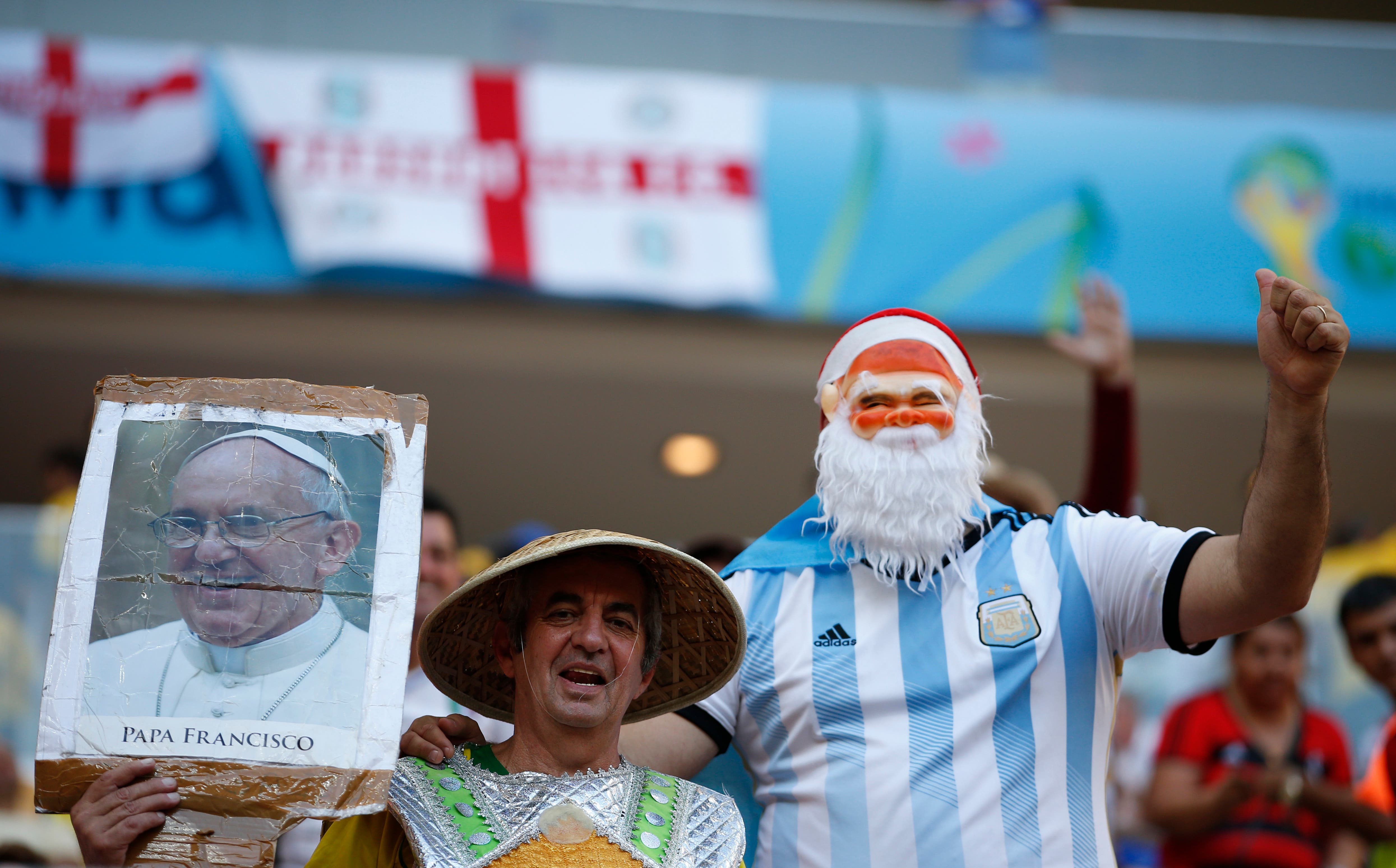 Football - England v Italy - FIFA World Cup Brazil 2014 - Group D - Arena Amazonia, Manaus, Brazil - 14/6/14 Argentina fans with a photo of Pope Francis before the match Mandatory Credit: Action Images / John Sibley Livepic