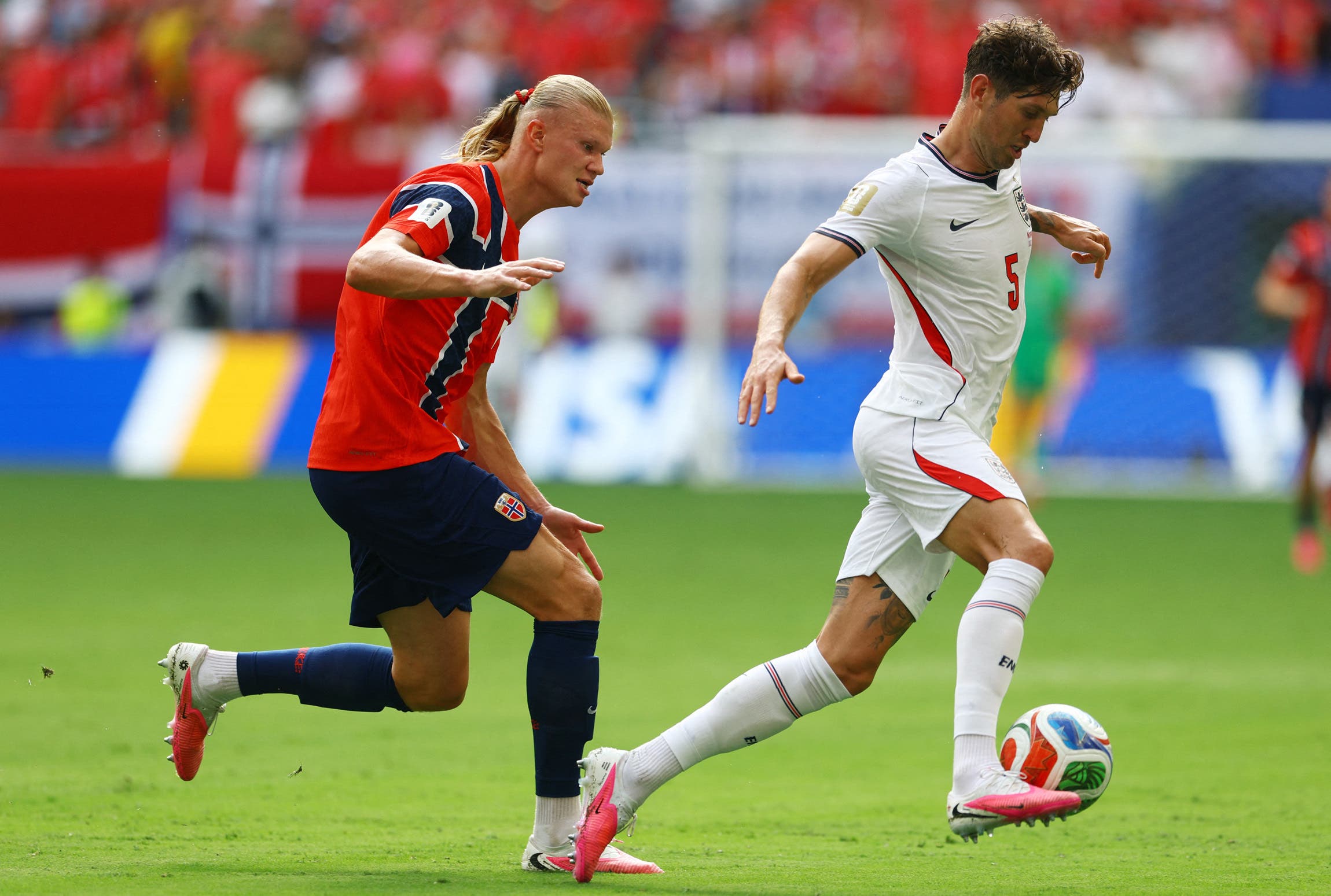 Soccer Football - FIFA World Cup 2026 - Quarter Final - Norway v England - Miami Stadium, Miami Gardens, Florida, U.S. - July 11, 2026 England's John Stones in action with Norway's Erling Haaland IMAGN IMAGES via Reuters/Nathan Ray Seebeck

