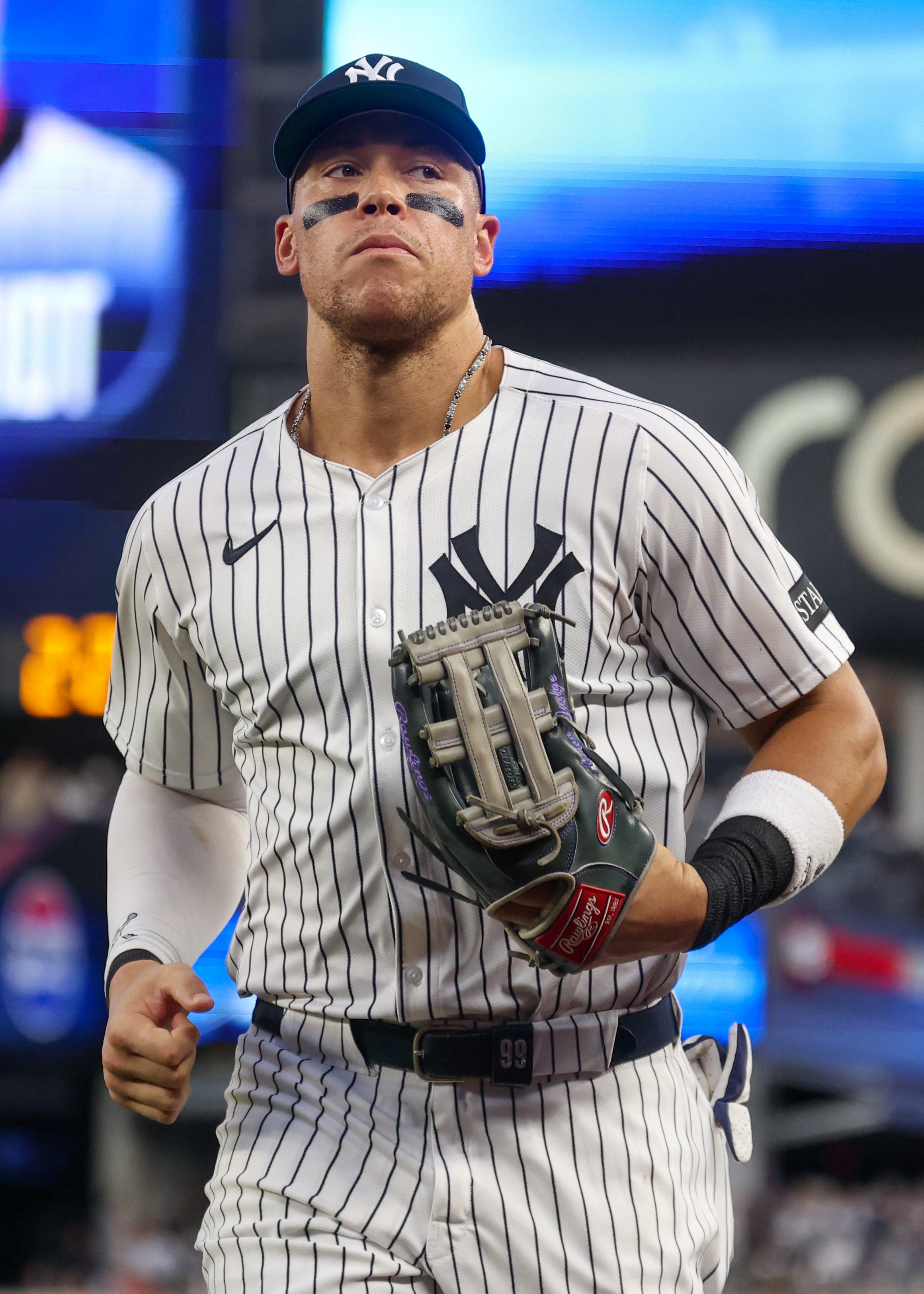 Jul 25, 2025; Bronx, New York, USA; New York Yankees right fielder Aaron Judge (99) runs in from the outfield after the top of the fourth inning against the Philadelphia Phillies at Yankee Stadium. Mandatory Credit: Vincent Carchietta-Imagn Images
