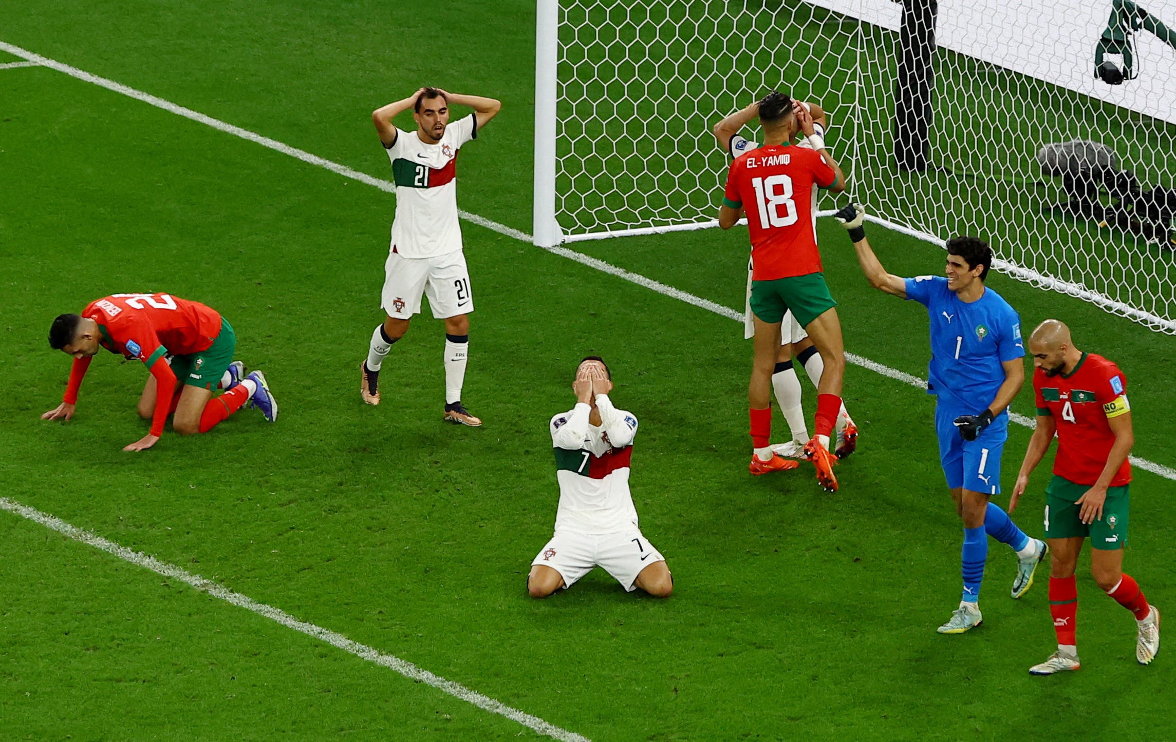 Soccer Football - FIFA World Cup Qatar 2022 - Quarter Final - Morocco v Portugal - Al Thumama Stadium, Doha, Qatar - December 10, 2022 Portugal's Cristiano Ronaldo and Morocco's Yassine Bounou react REUTERS/Paul Childs