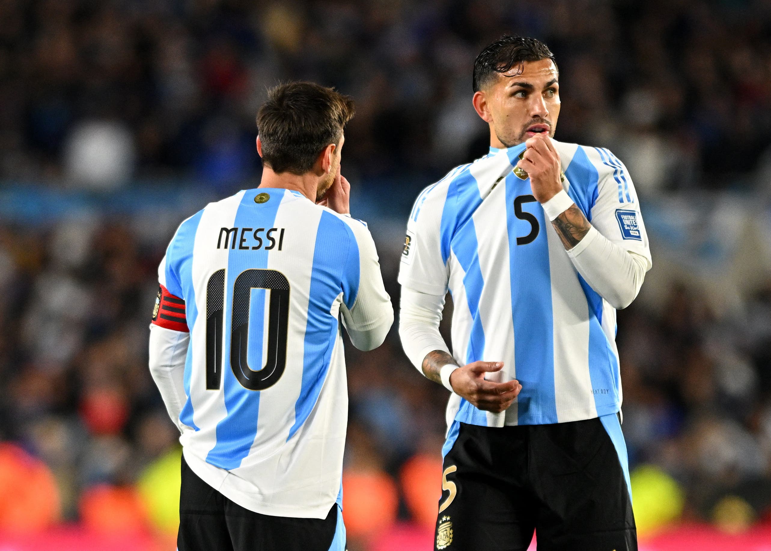 Soccer Football - World Cup - CONMEBOL Qualifiers - Argentina v Venezuela - Estadio Monumental, Buenos Aires, Argentina - September 4, 2025 Argentina's Lionel Messi reacts with Leandro Paredes REUTERS/Rodrigo Valle
