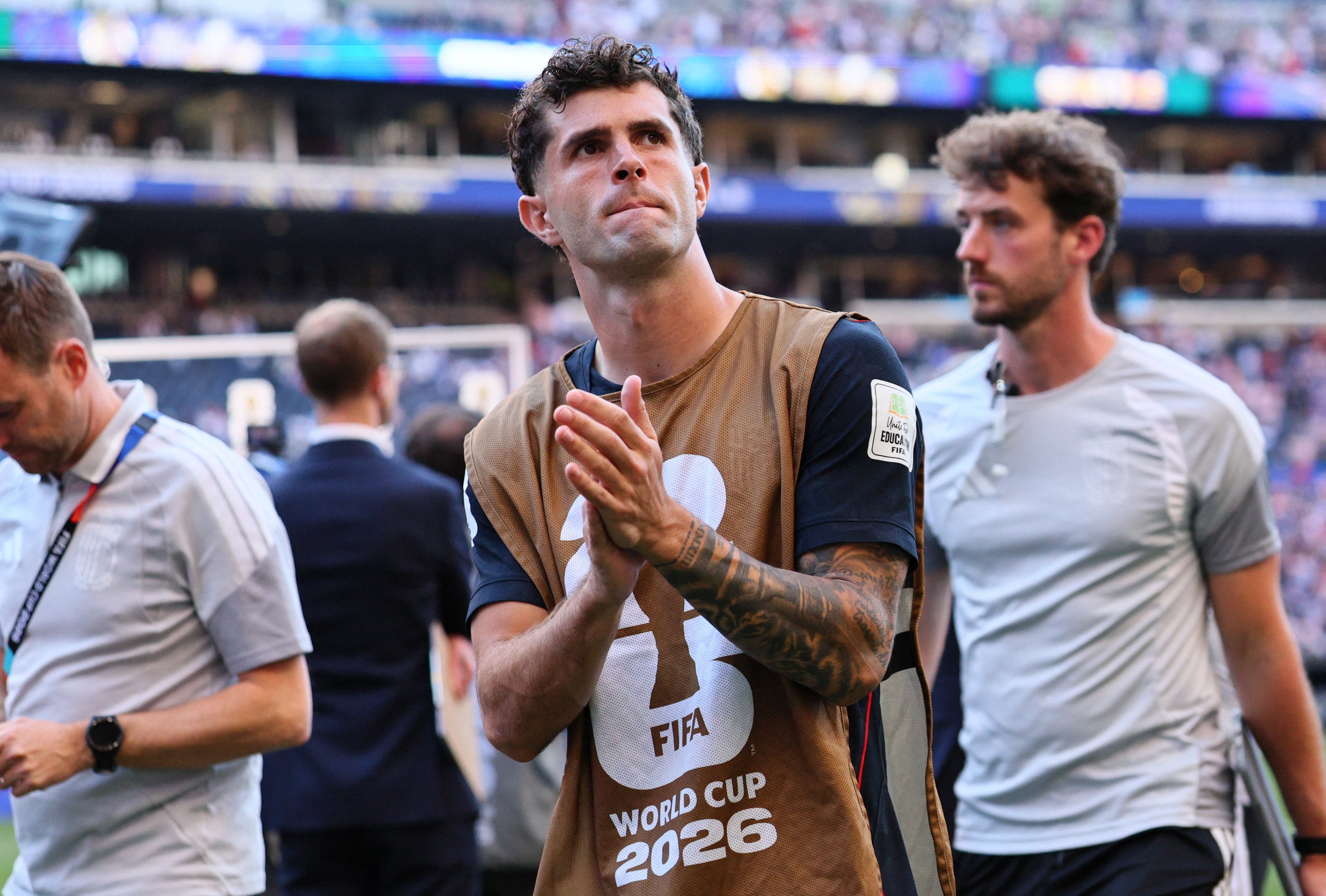 Soccer Football - FIFA World Cup 2026 - Round of 16 - United States v Belgium - Seattle Stadium, Seattle, Washington, U.S. - July 6, 2026 Christian Pulisic of the U.S. looks dejected as he applauds fans after the match following their elimination from the World Cup IMAGN IMAGES via Reuters/Blake Dahlin

