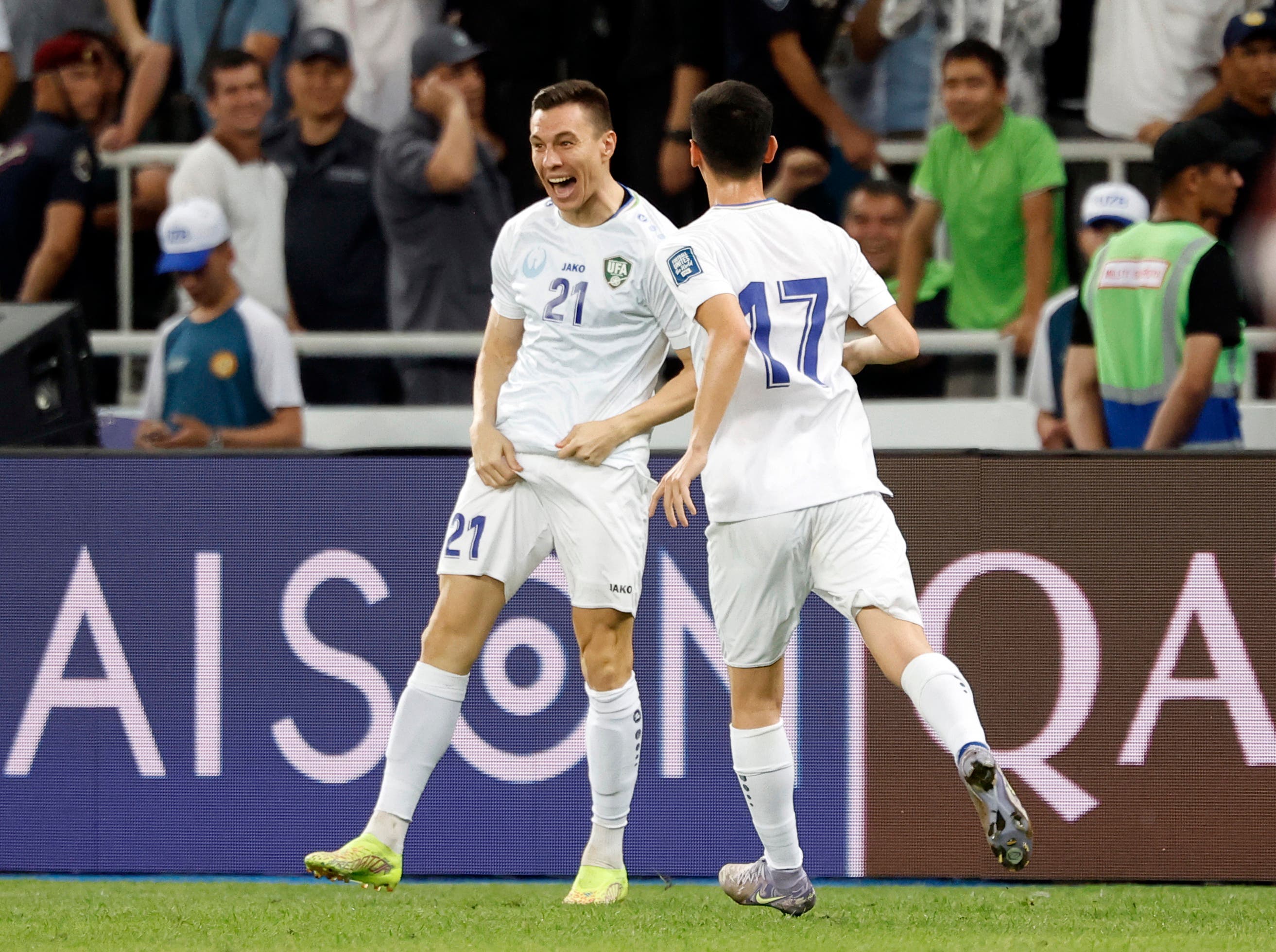 Soccer Football - World Cup - AFC Qualifiers - Group A - Uzbekistan v Qatar - Milliy Stadium, Tashkent, Uzbekistan - June 10, 2025 Uzbekistan's Igor Sergeev celebrates scoring their third goal with Abdurauf Buriev REUTERS/Maxim Shemetov