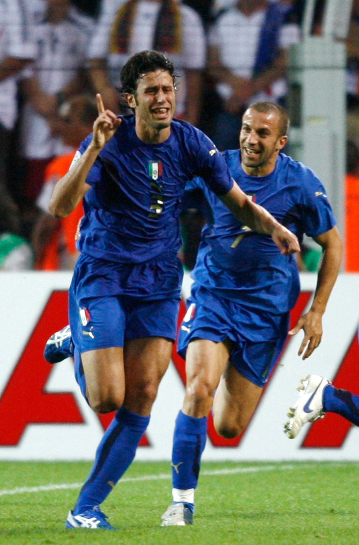 Italy's Fabio Grosso (L) celebrates his goal against Germany with team mate Alessandro Del Piero during their World Cup 2006 semi-final soccer match in Dortmund 