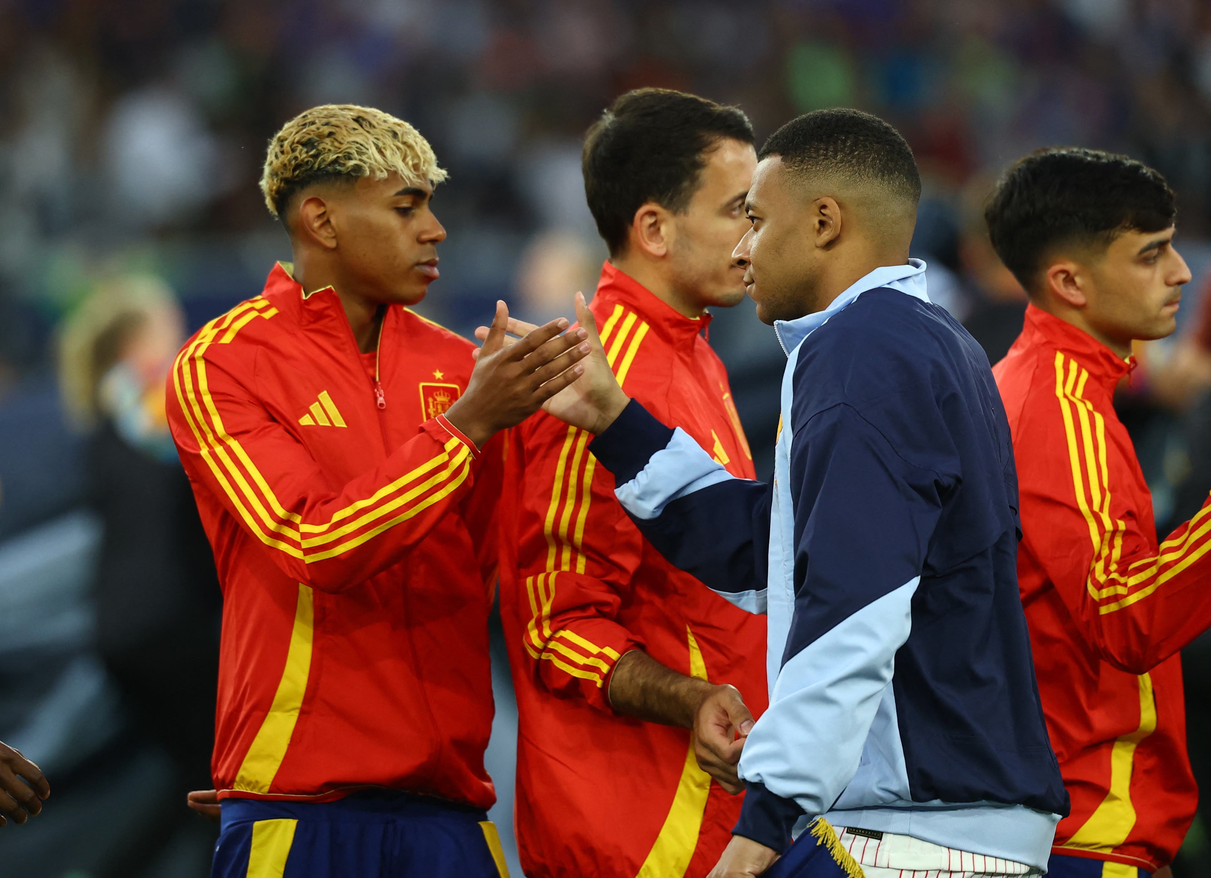 Soccer Football - Nations League - Semi Final - Spain v France - MHPArena, Stuttgart, Germany - June 5, 2025 Spain's Lamine Yamal shakes hands with France's Kylian Mbappe before the match REUTERS/Kai Pfaffenbach