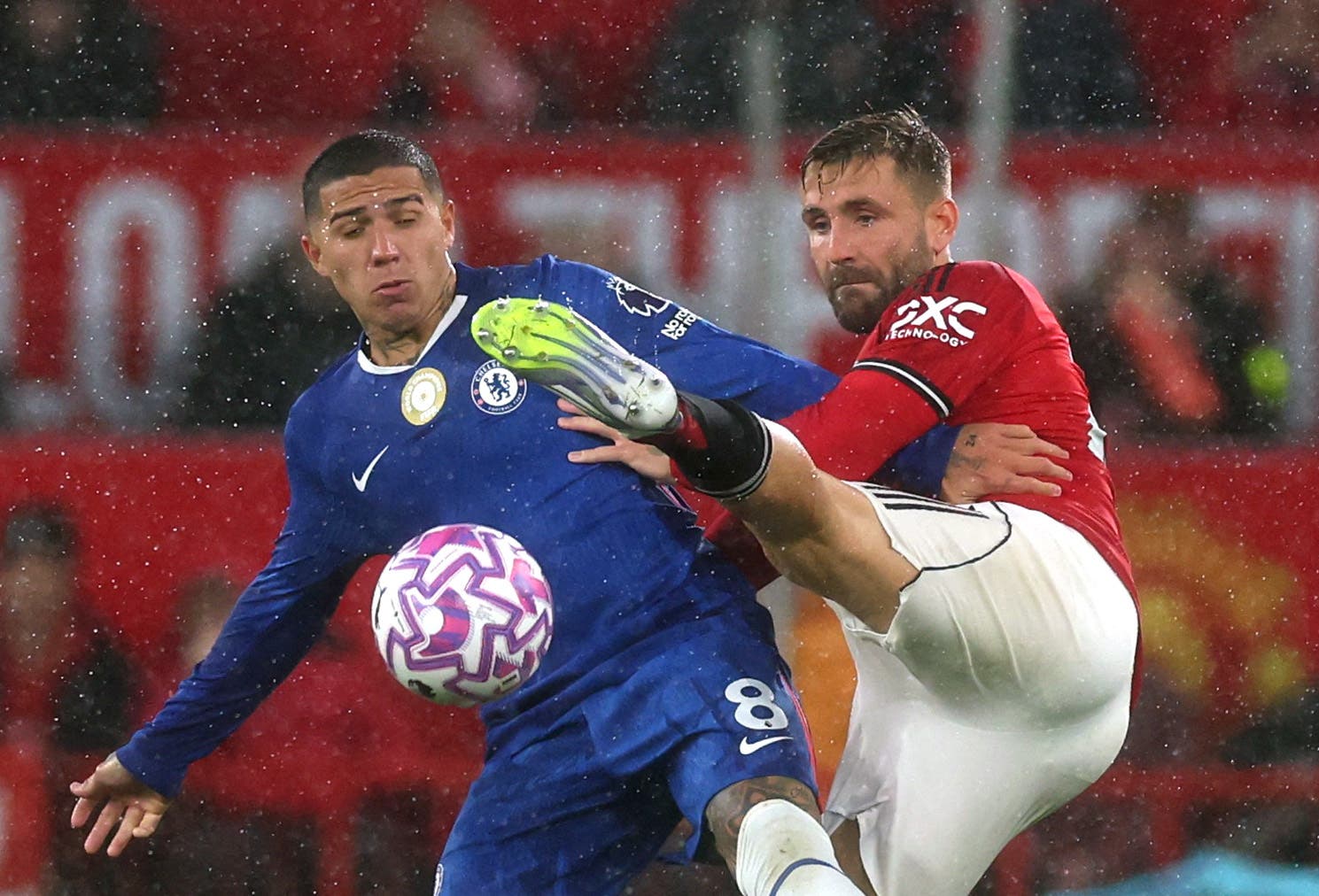 Soccer Football - Premier League - Manchester United v Chelsea - Old Trafford, Manchester, Britain - September 20, 2025 Chelsea's Enzo Fernandez in action with Manchester United's Luke Shaw REUTERS/Phil Noble