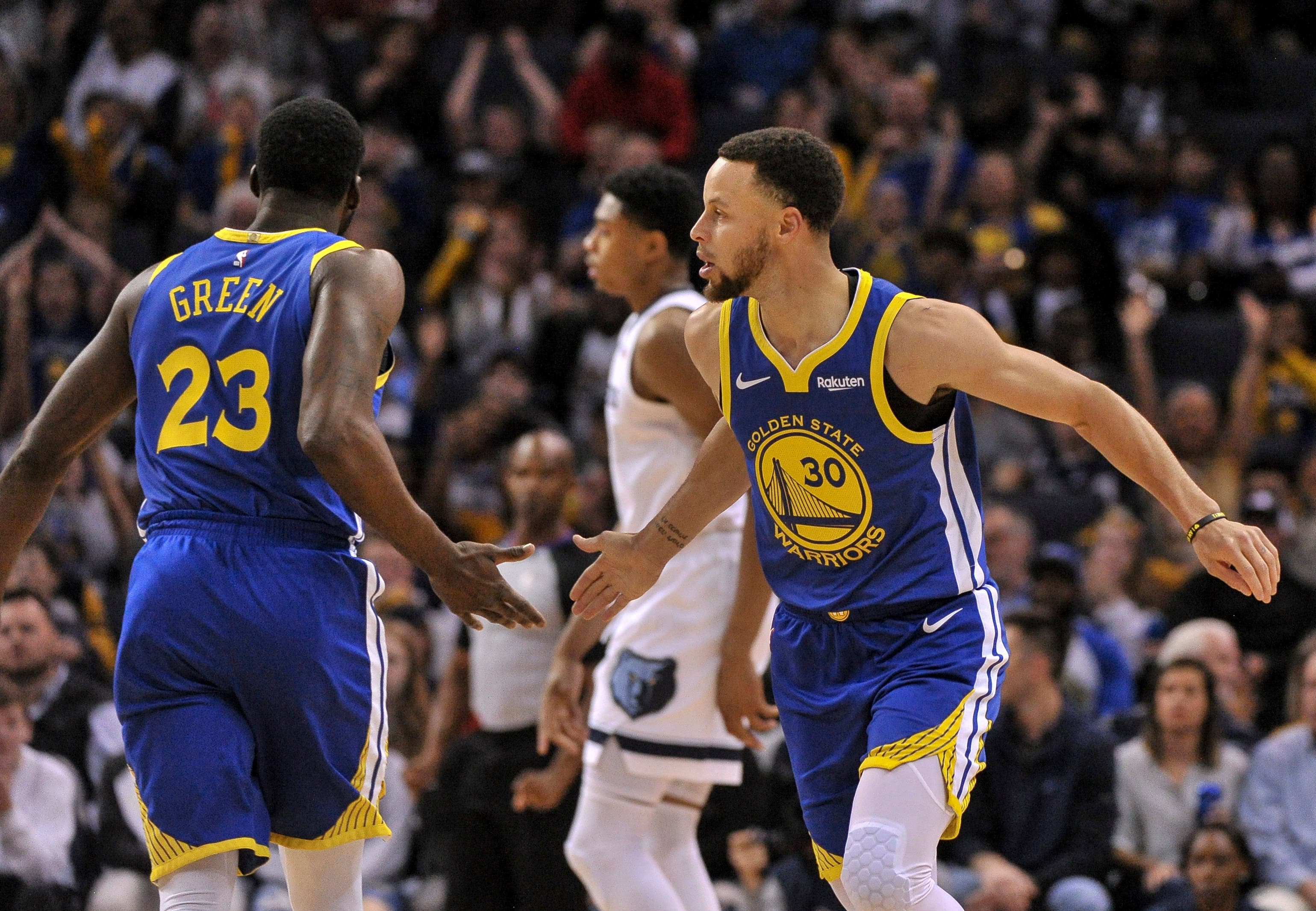 Stephen Curry with Draymond Green for the Golden State Warriors against the Memphis Grizzlies in 2019.