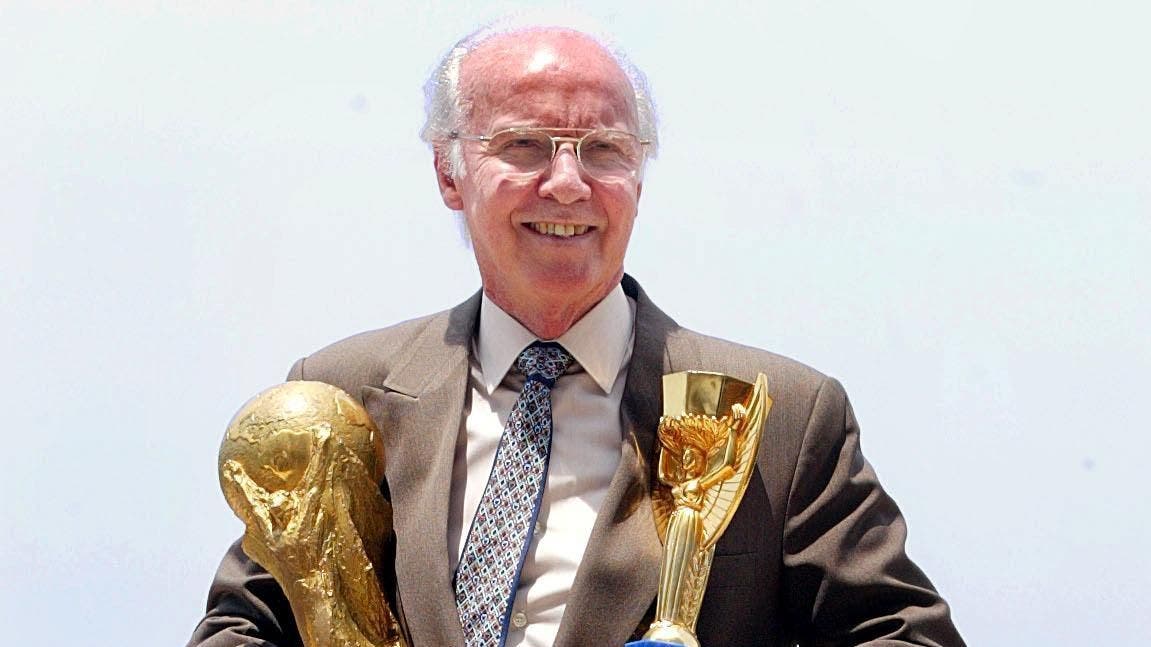 Mario Zagallo with two of his four world champion trophys from the World Cup.