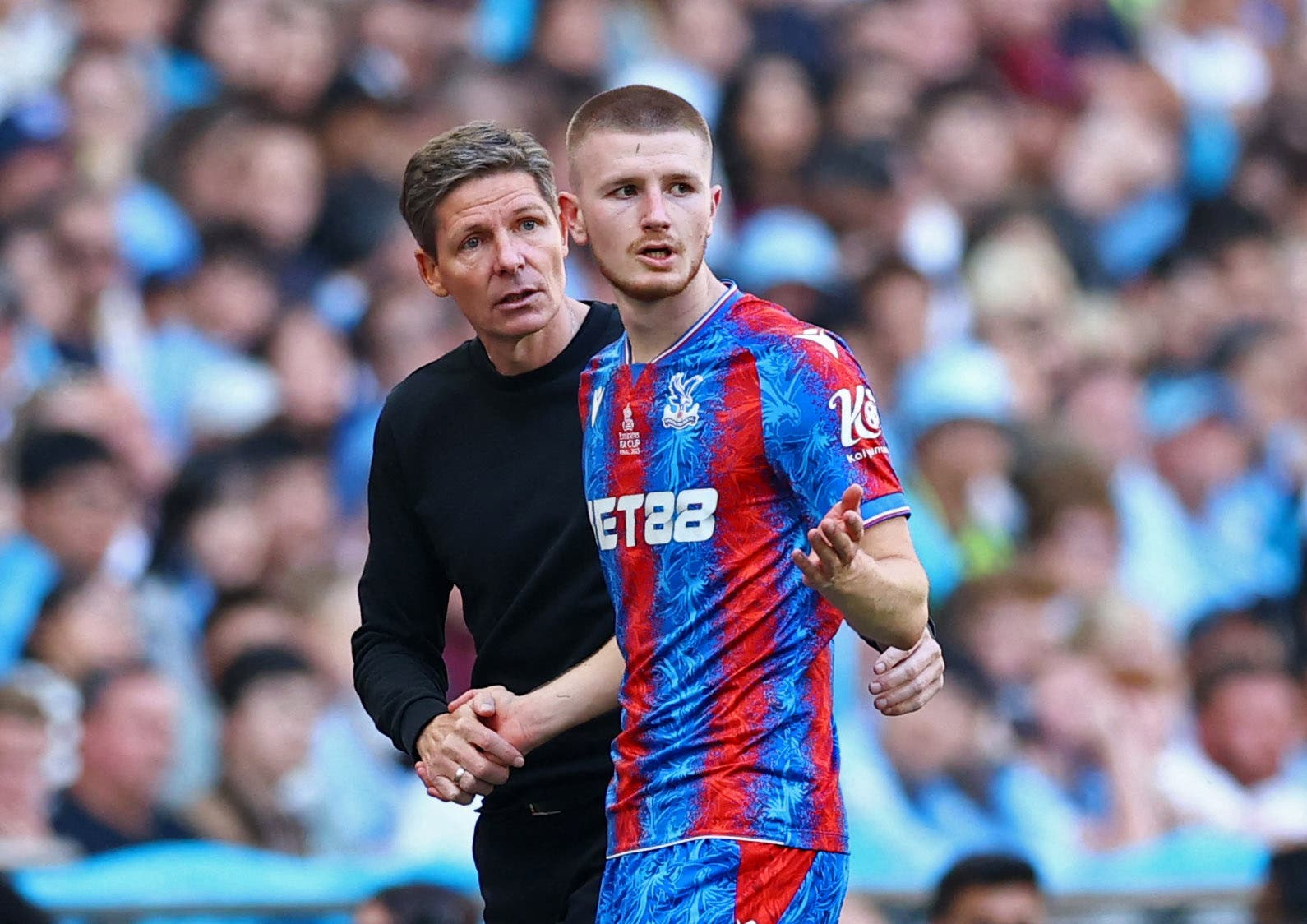 Crystal Palace's Adam Wharton shakes hands with manager Oliver Glasner after being substituted