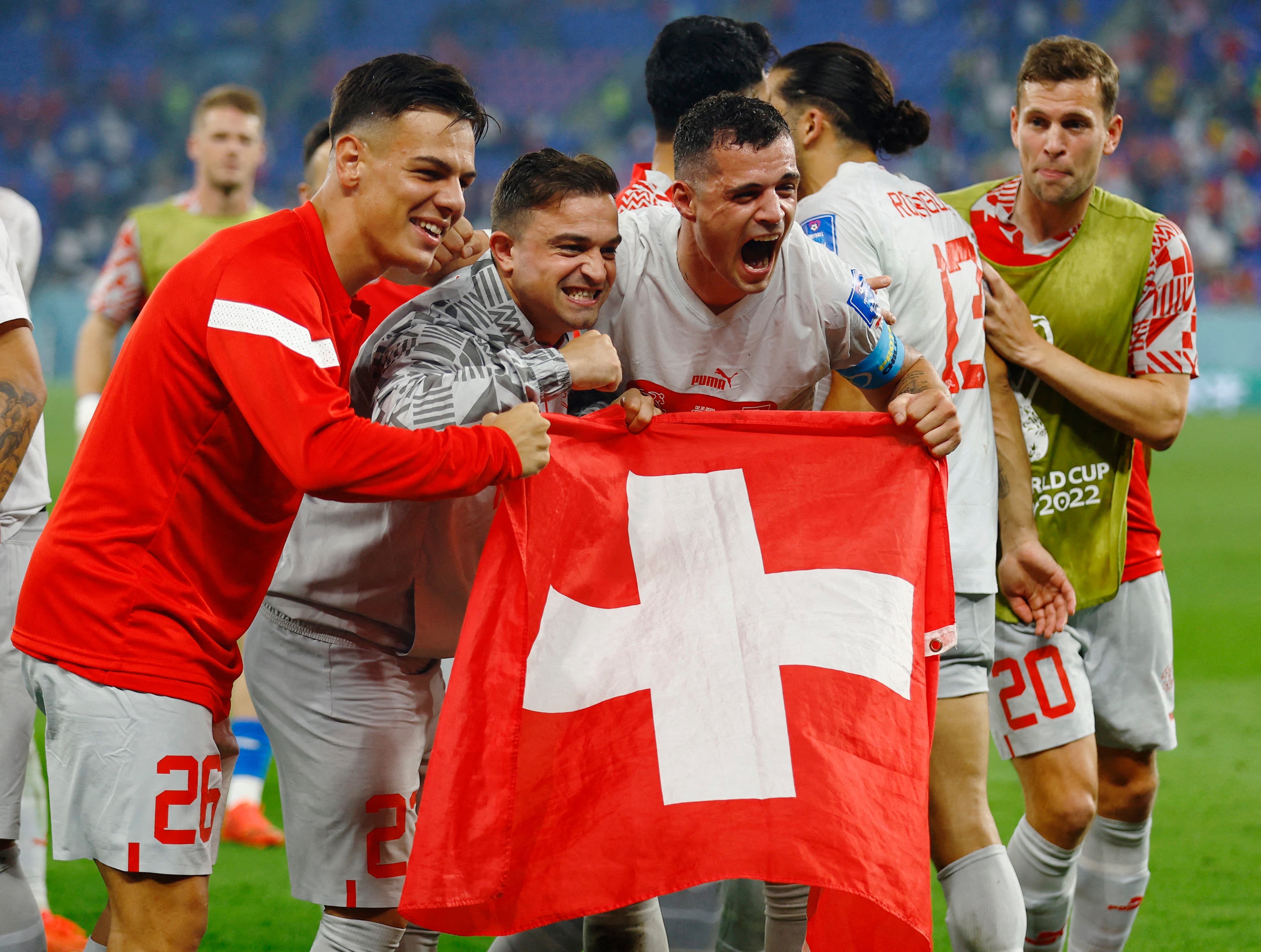 Soccer Football - FIFA World Cup Qatar 2022 - Group G - Serbia v Switzerland - Stadium 974, Doha, Qatar - December 3, 2022 Switzerland's Granit Xhaka and teammates celebrate qualifying for the knockout stages REUTERS/Suhaib Salem