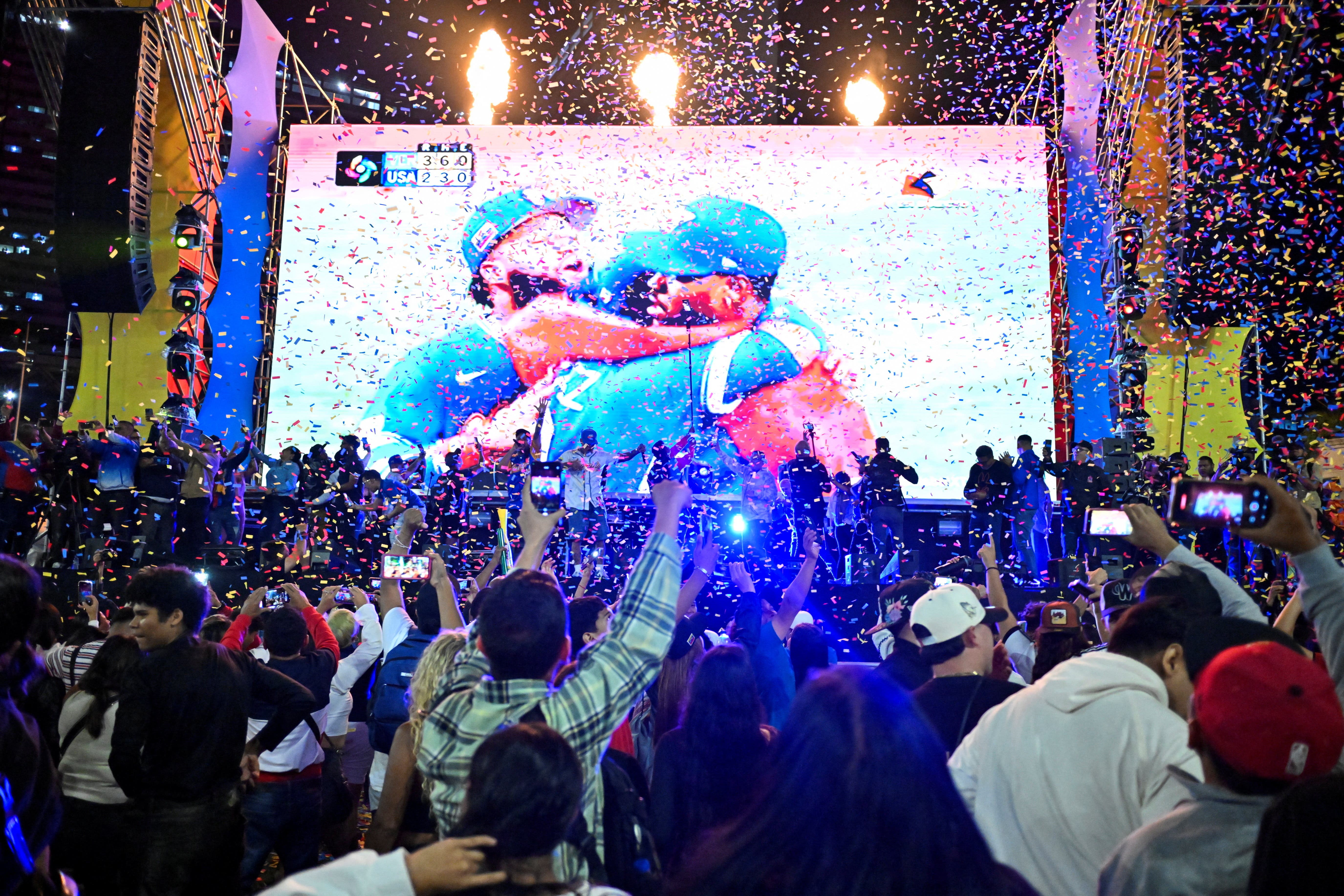 People celebrate Venezuela's victory over the U.S. in the World Baseball Classic final in Caracas, Venezuela, March 17, 2026. REUTERS/Maxwell Briceno