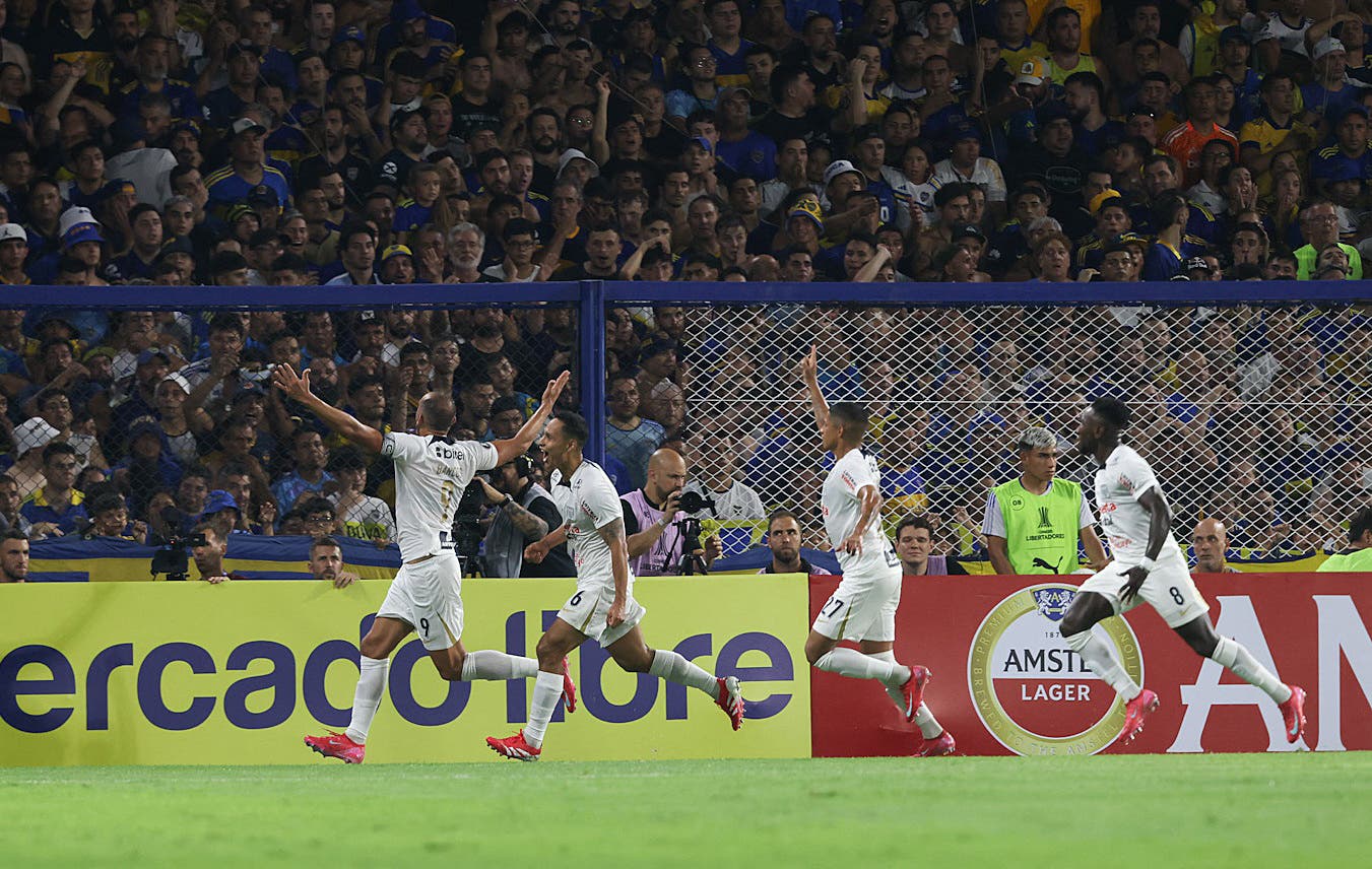 Alianza Lima's Herna Barcos celebrates scoring their first goal with teammates