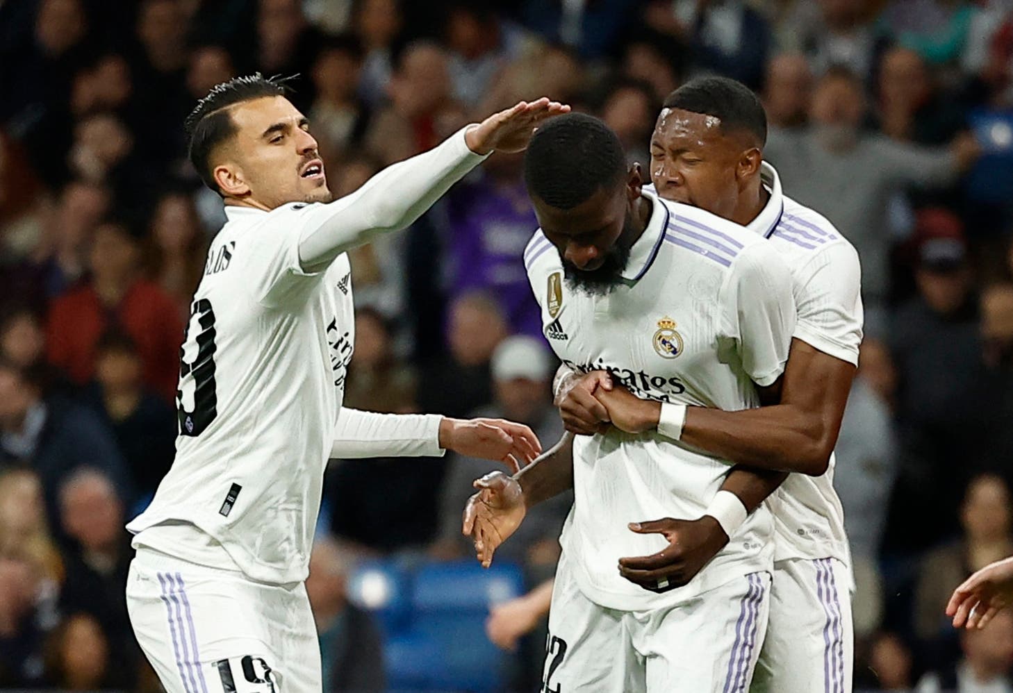 Soccer Football - Champions League - Quarter Finals - First Leg - Real Madrid v Chelsea - Santiago Bernabeu, Madrid, Spain - April 12, 2023 Real Madrid's Dani Ceballos and David Alaba congratulate Antonio Rudiger after blocking a shot from Chelsea's Mason Mount REUTERS/Juan Medina
