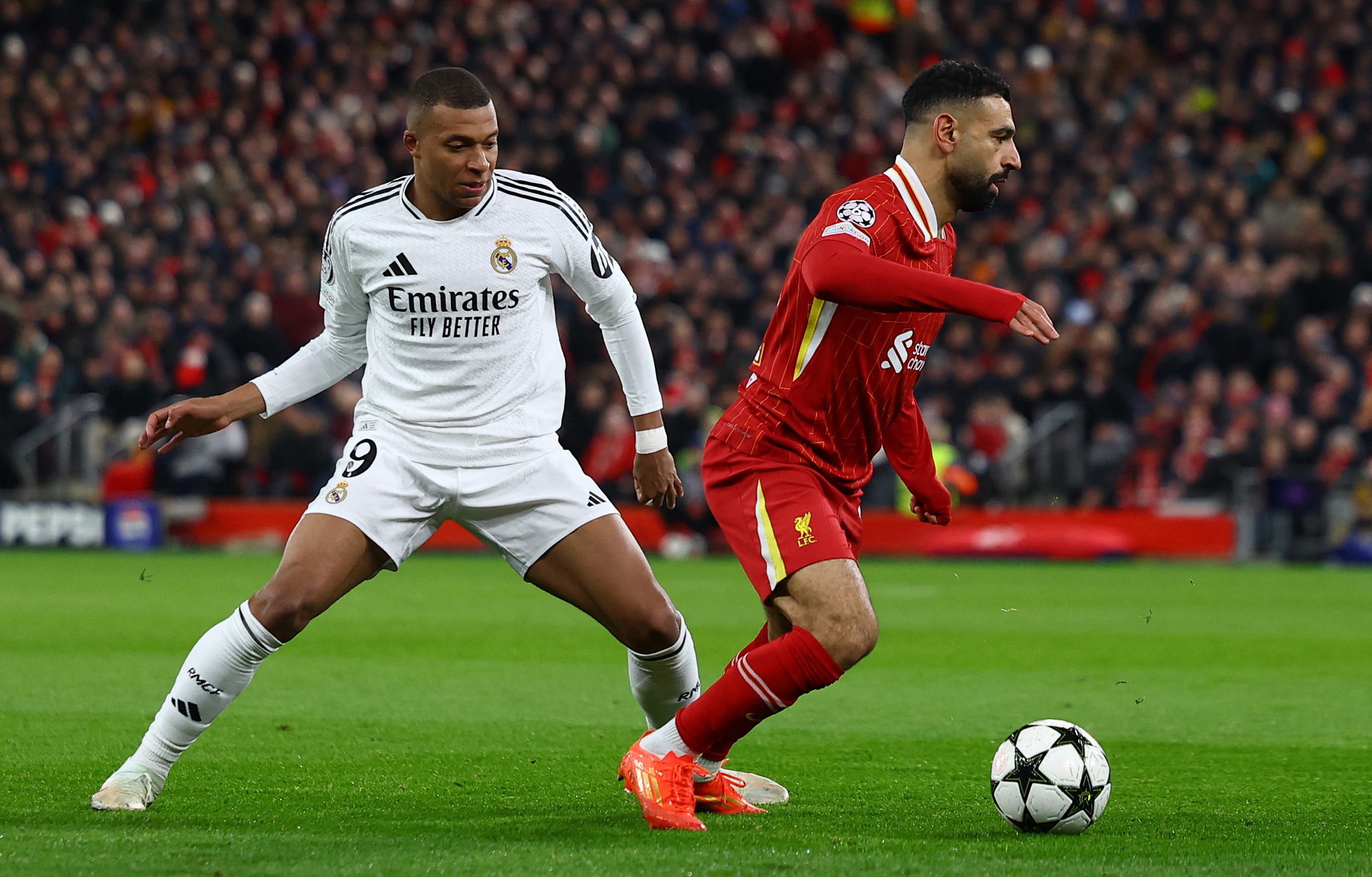 Soccer Football - Champions League - Liverpool v Real Madrid - Anfield, Liverpool, Britain - November 27, 2024 Real Madrid's Kylian Mbappe in action with Liverpool's Mohamed Salah Action Images via Reuters/Lee Smith
