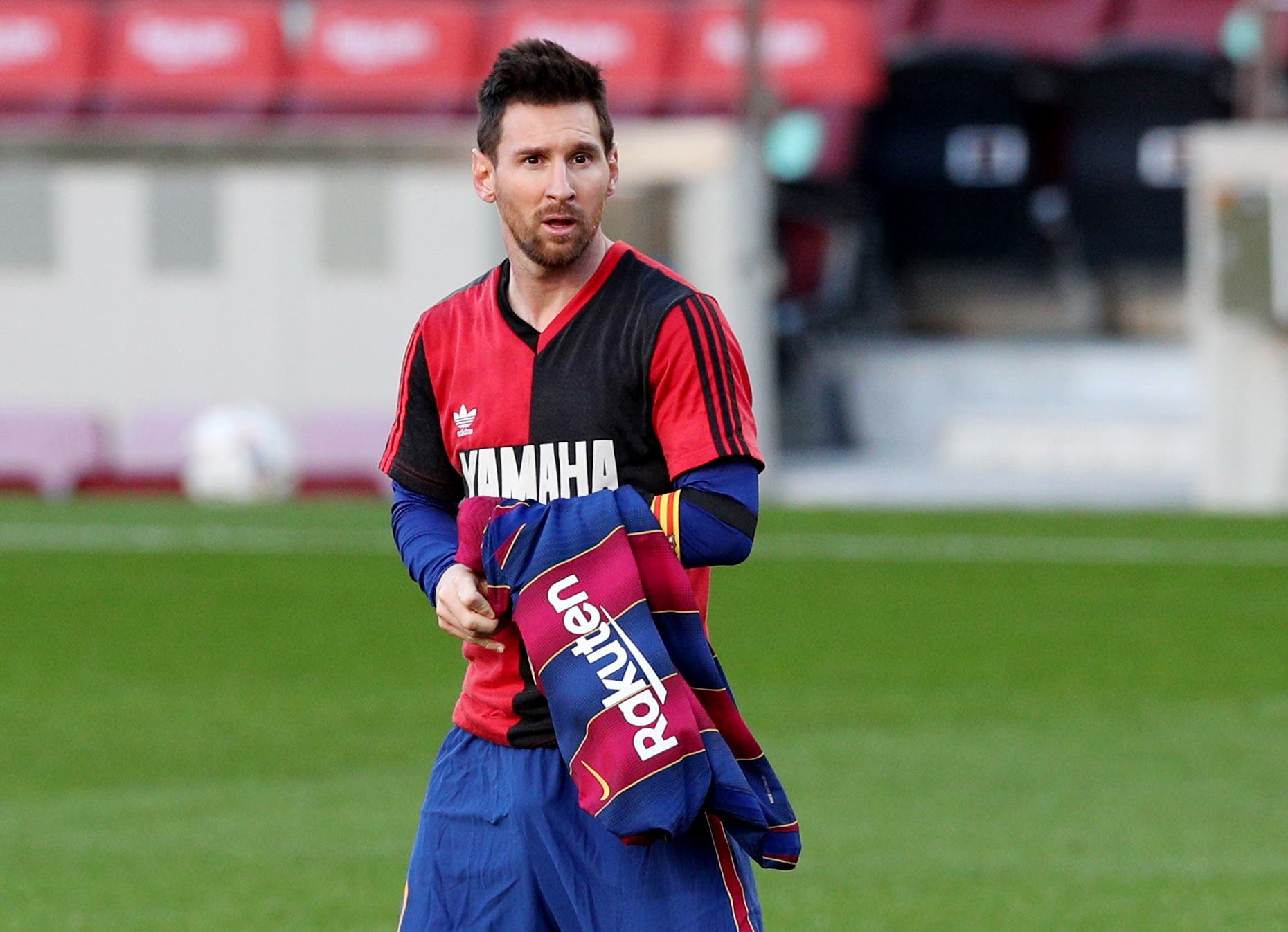 FC Barcelona's Lionel Messi celebrates scoring their fourth goal wearing a Newell's Old Boys shirt in reference to former player Diego Maradona