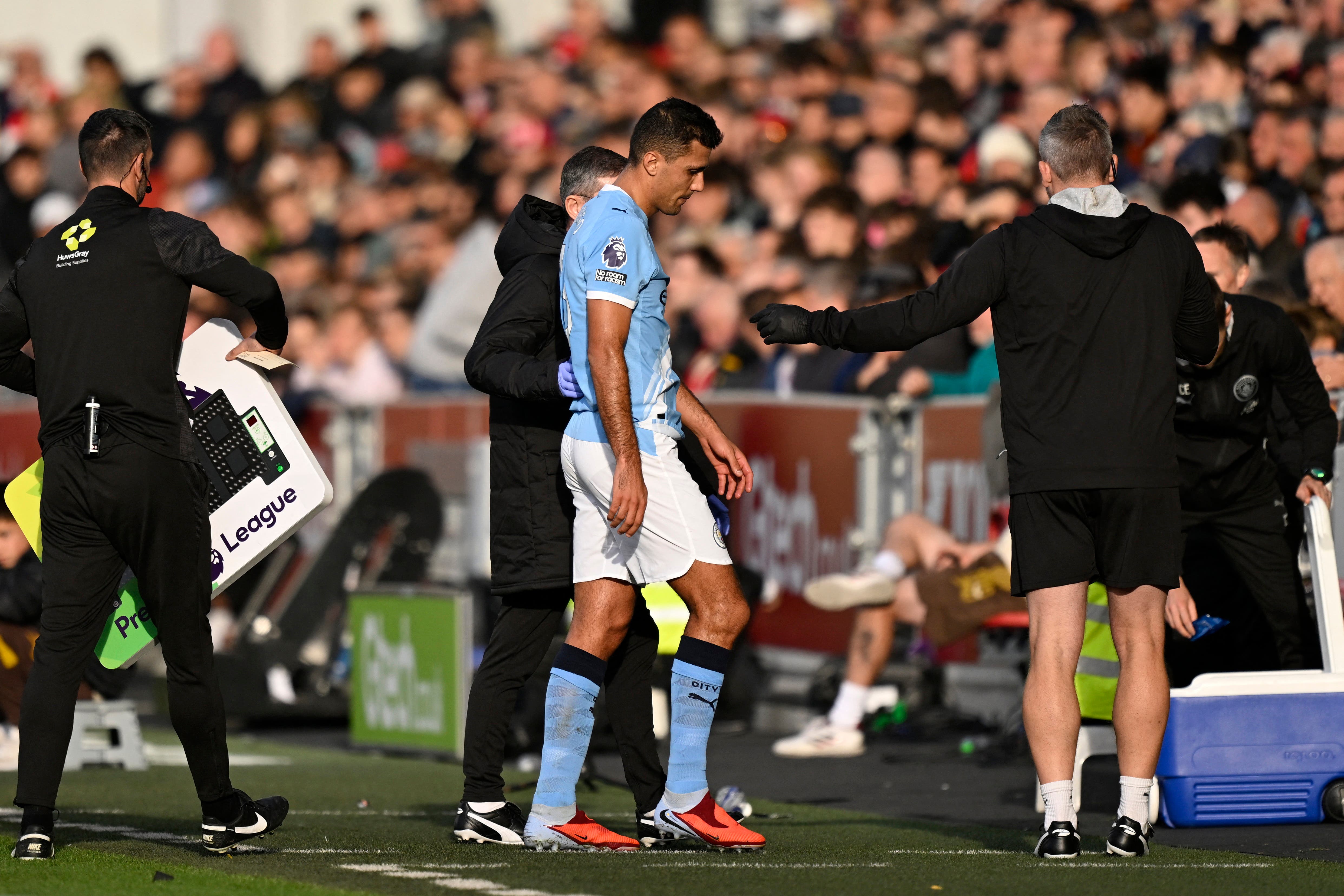 Rodri walks off the pitch injured during the game between Brentford and Manchester City.