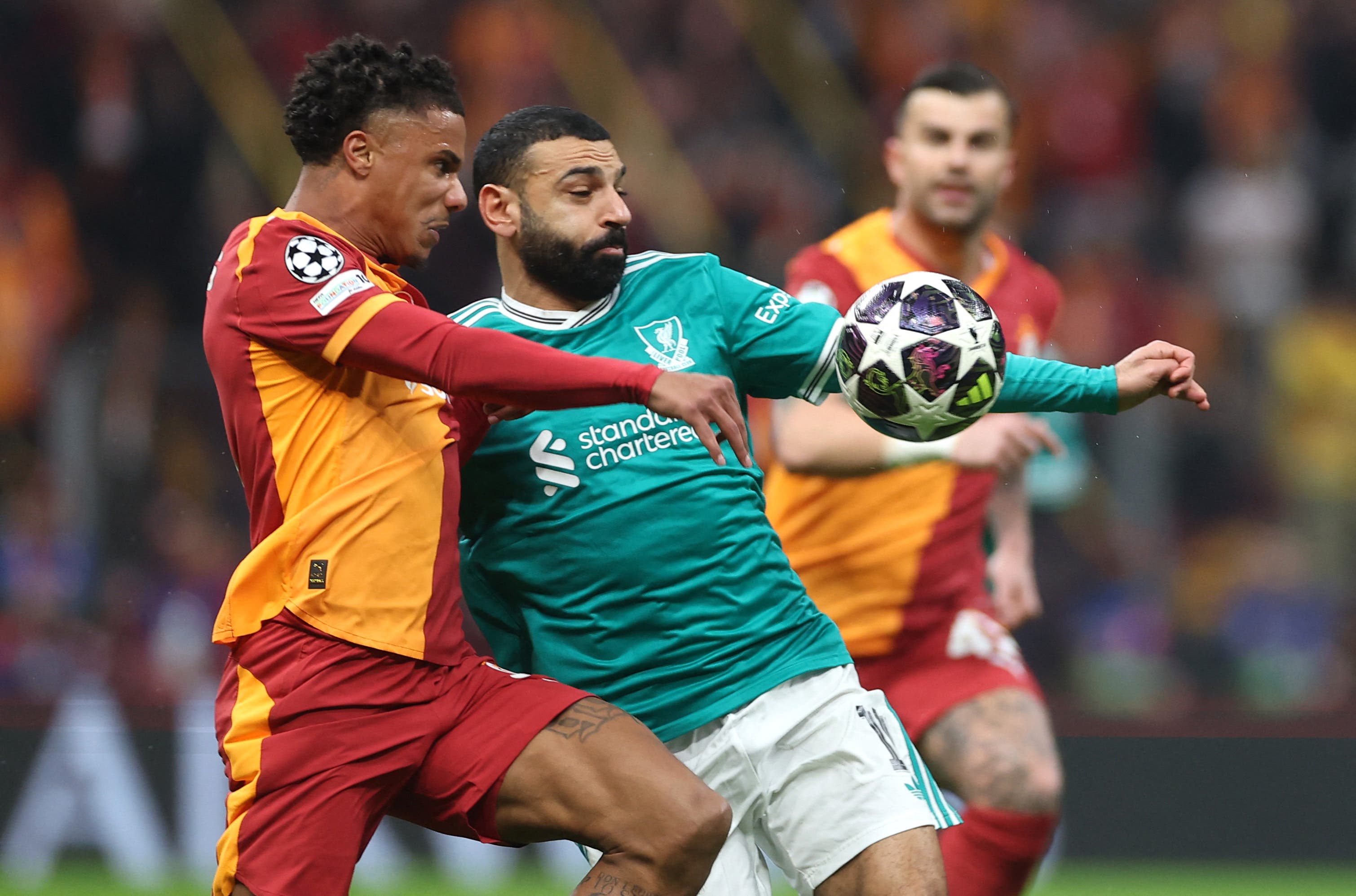 Soccer Football - UEFA Champions League - Round of 16 - First Leg - Galatasaray v Liverpool - Rams Park, Istanbul, Turkey - March 10, 2026 Galatasaray's Ismail Jakobs in action with Liverpool's Mohamed Salah REUTERS/Umit Bektas