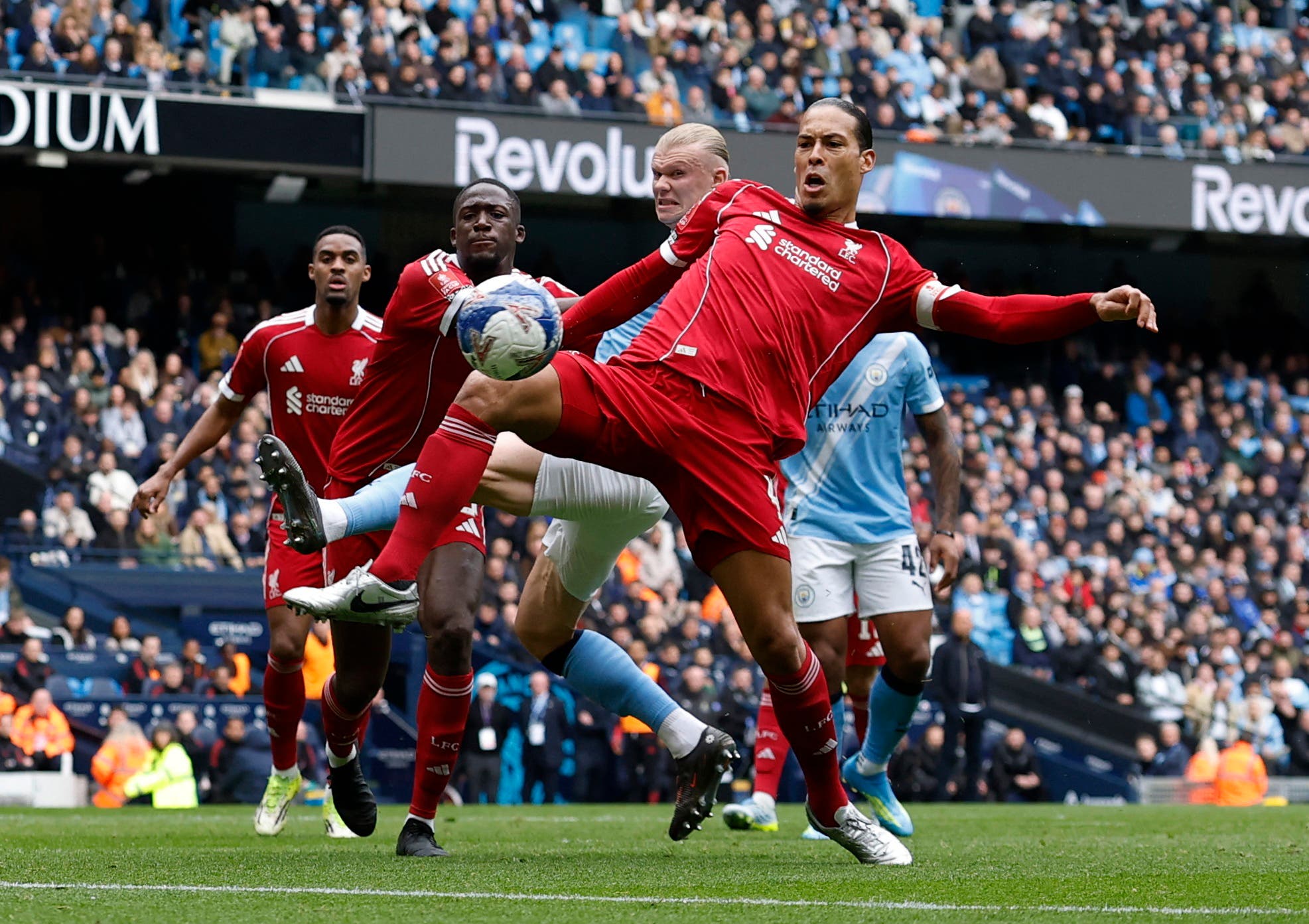 Soccer Football - FA Cup - Quarter Final - Manchester City v Liverpool - Etihad Stadium, Manchester, Britain - April 4, 2026 Liverpool's Virgil van Dijk in action with Manchester City's Erling Haaland Action Images via Reuters/Jason Cairnduff