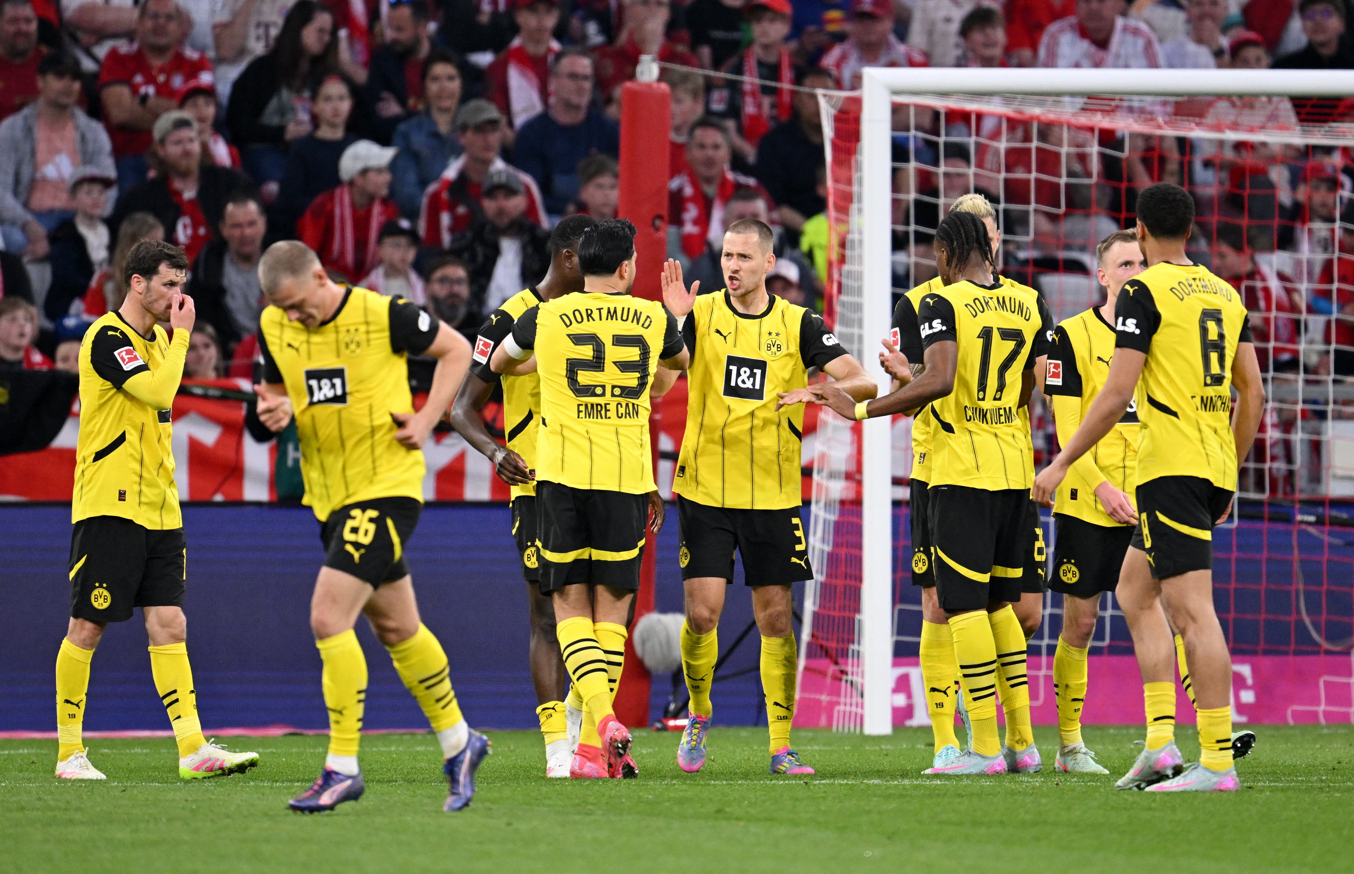 Borussia Dortmund's Waldemar Anton celebrates scoring their second goal with teammates 