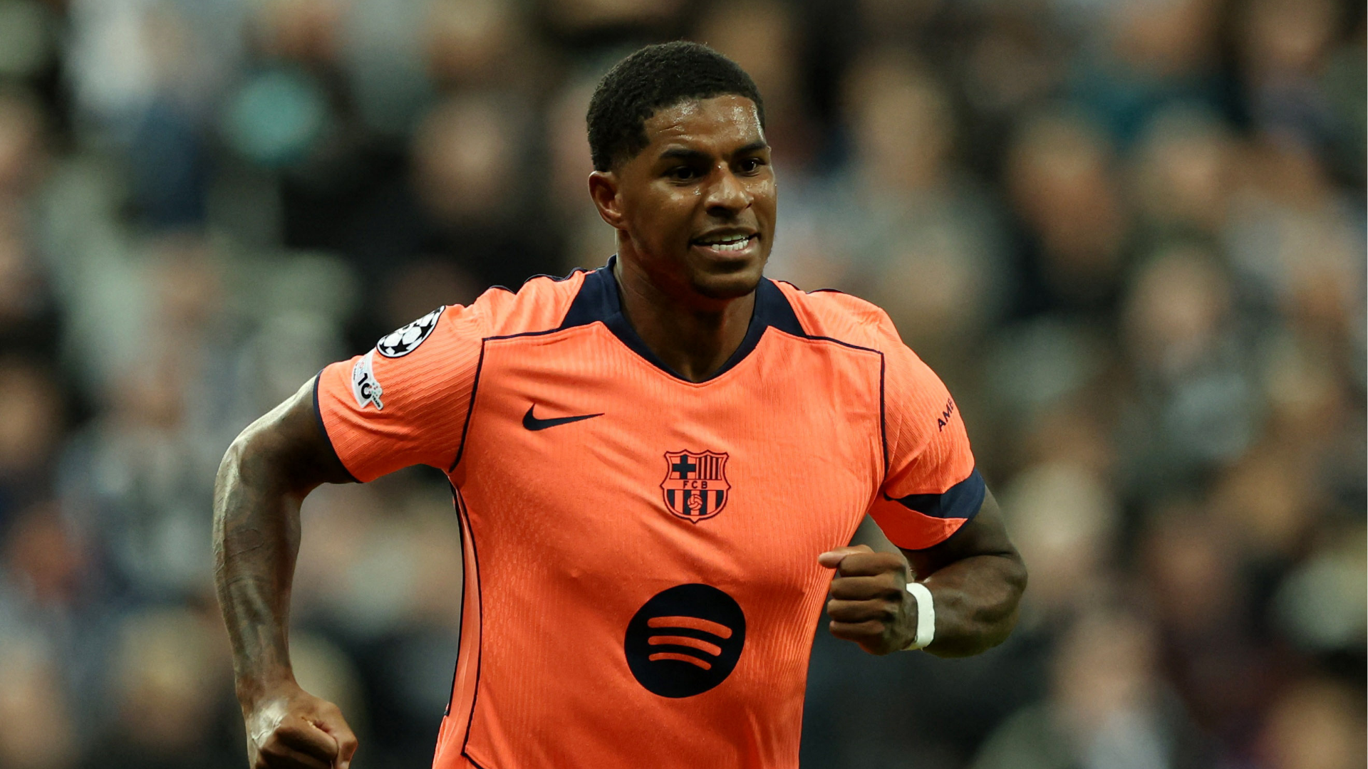 Marcus Rahsford celebrates a goal during a match with FC Barcelona.