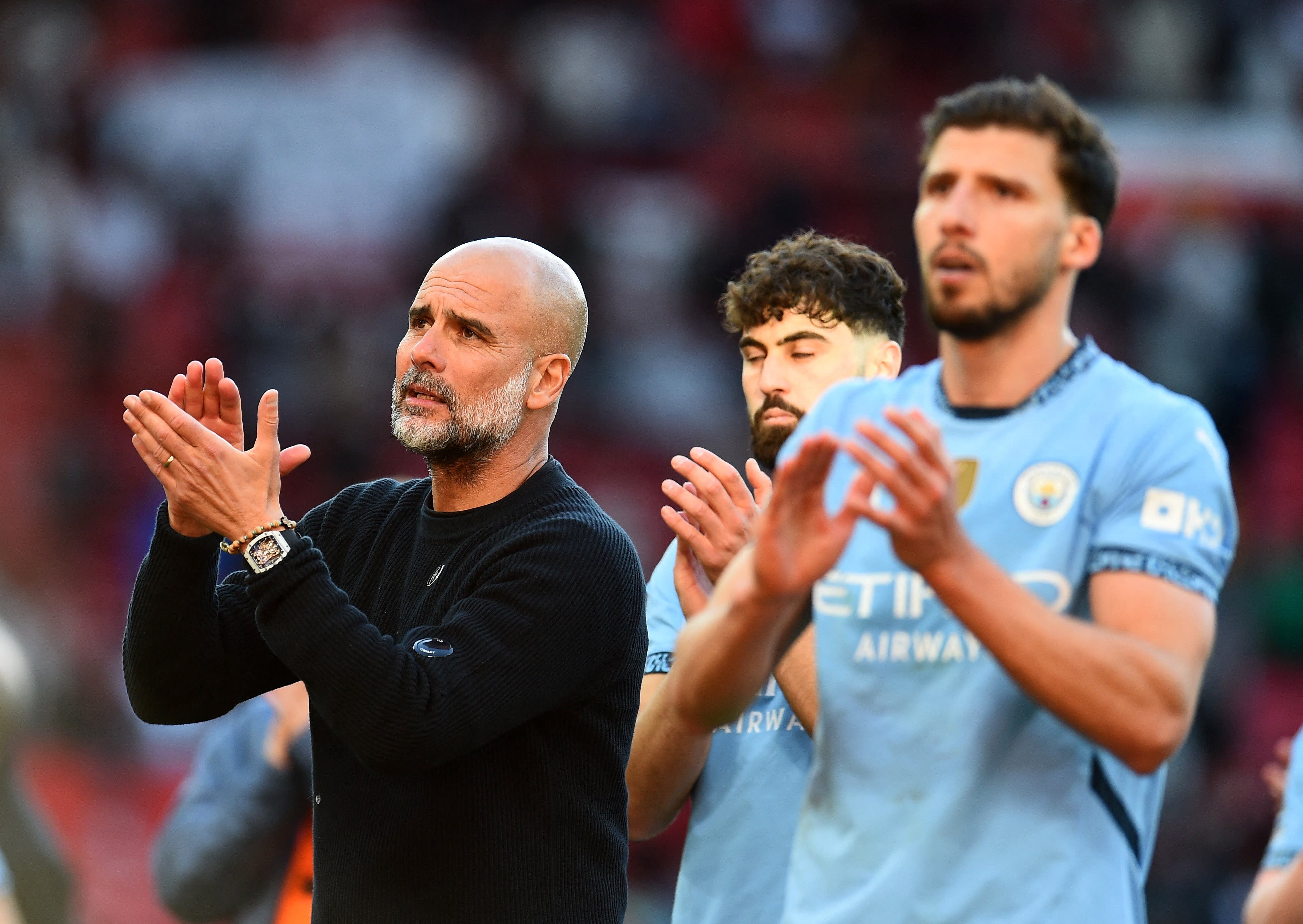 Manchester City manager Pep Guardiola applauds fans after the match 