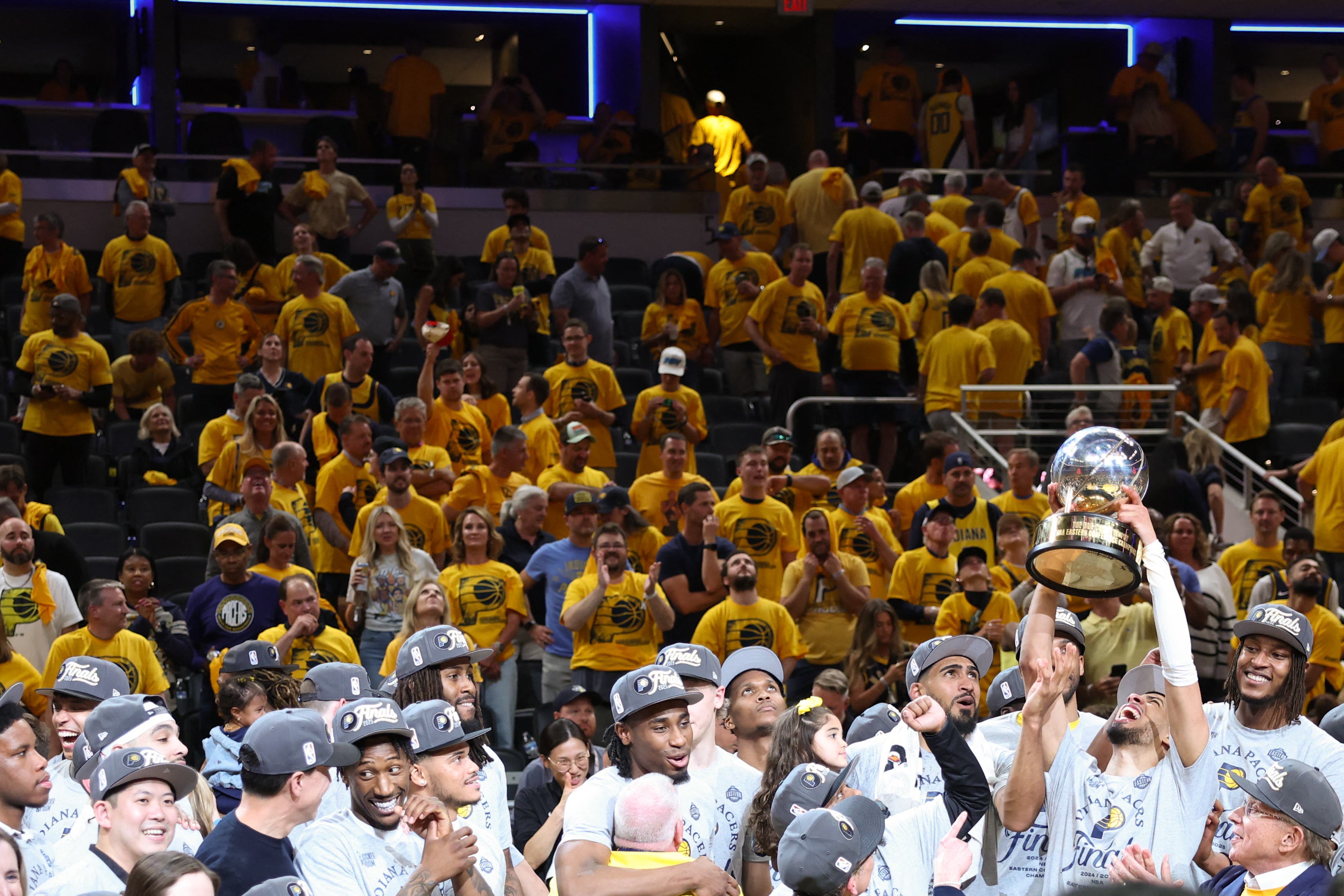 Indiana Pacers lifting the Eastern Conference Finals trophy against the New York Knicks.