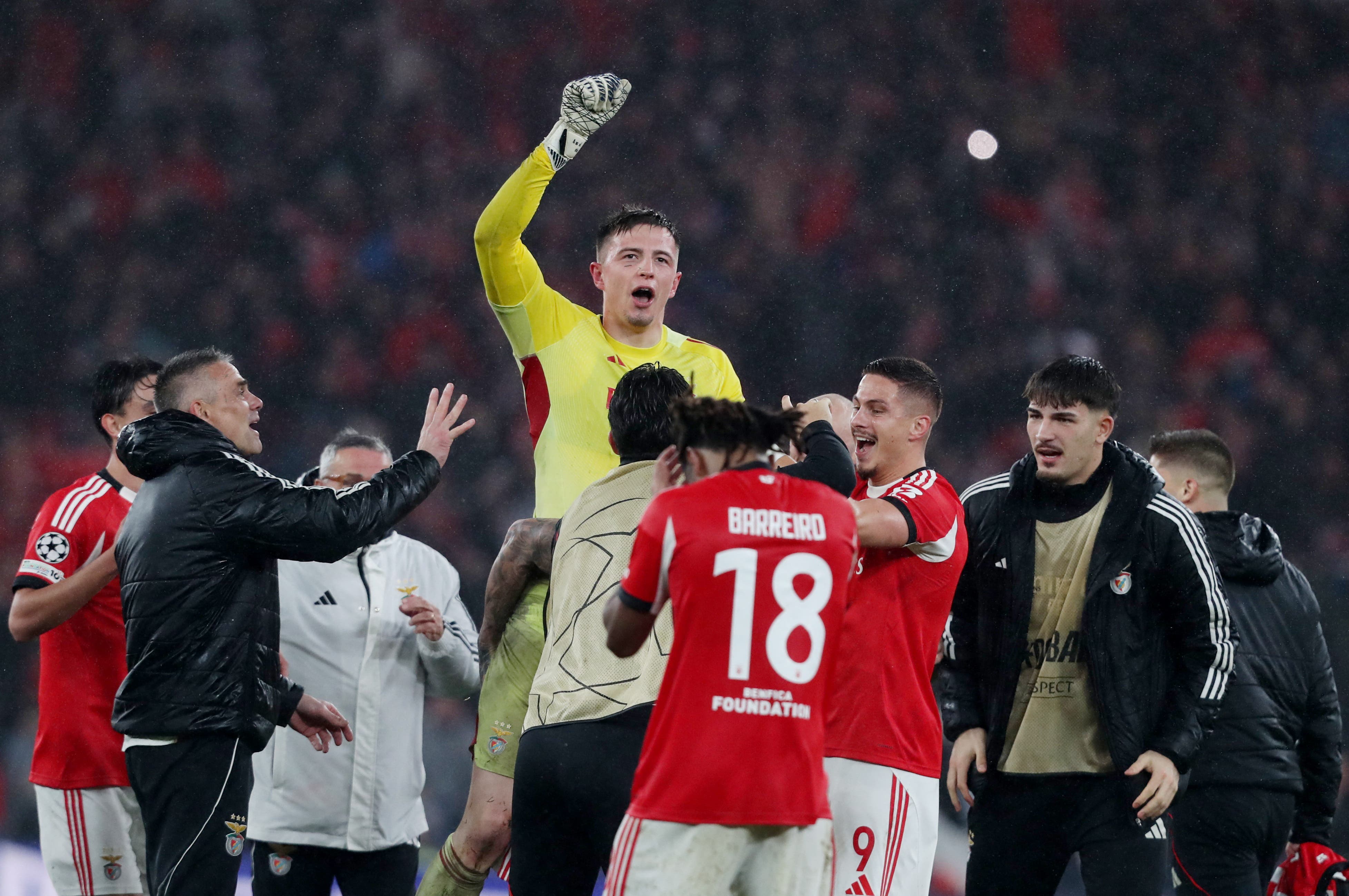 Soccer Football - UEFA Champions League - Benfica v Real Madrid - Estadio da Luz, Lisbon, Portugal - January 28, 2026 Benfica's Anatoliy Trubin celebrates scoring their fourth goal with teammates REUTERS/Pedro Rocha