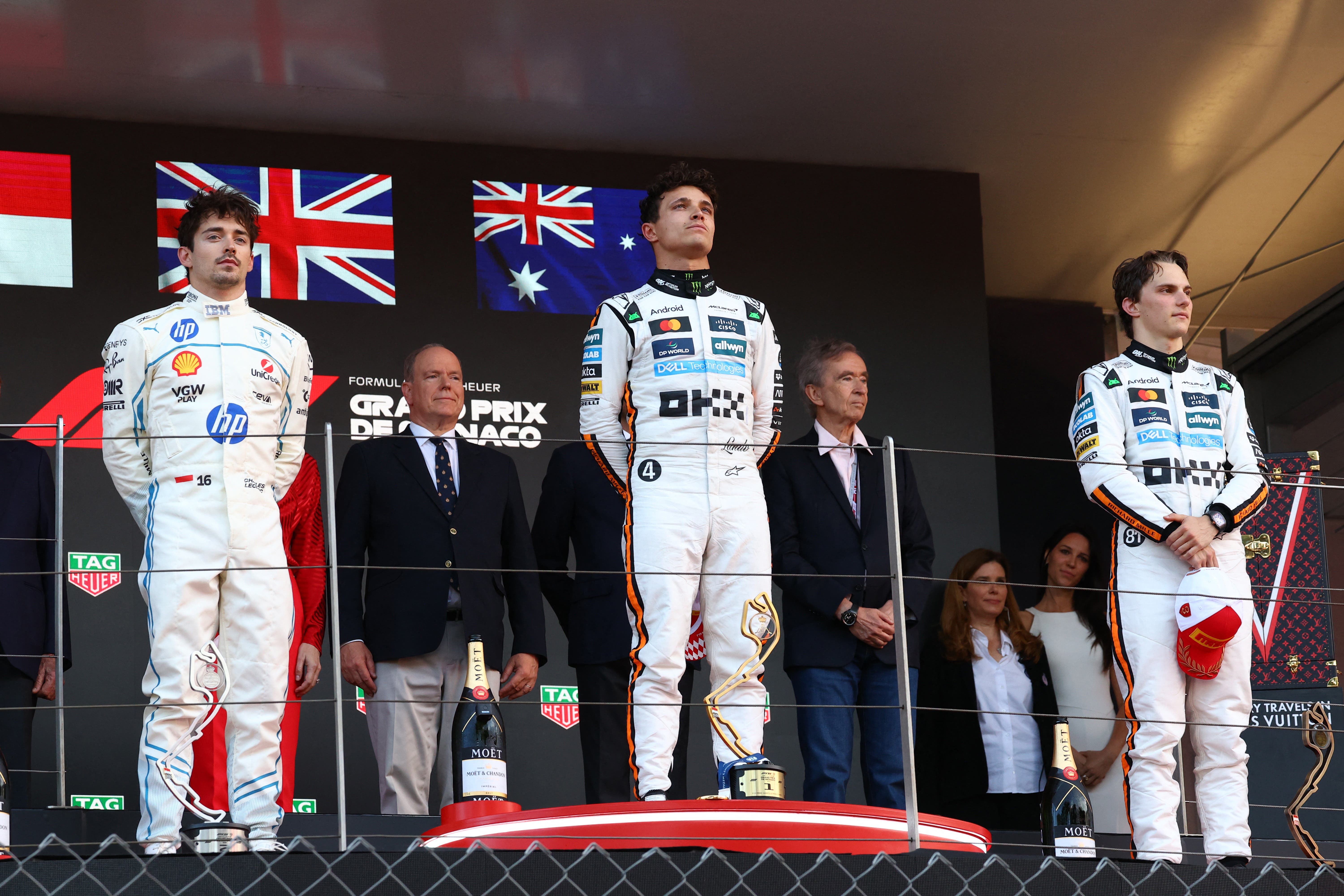 Formula One F1 - Monaco Grand Prix - Circuit de Monaco, Monaco - May 25, 2025 McLaren's Lando Norris on the podium after winning the Monaco Grand Prix alongside second placed Ferrari's Charles Leclerc and third placed McLaren's Oscar Piastri REUTERS/Piroschka Van De Wouw