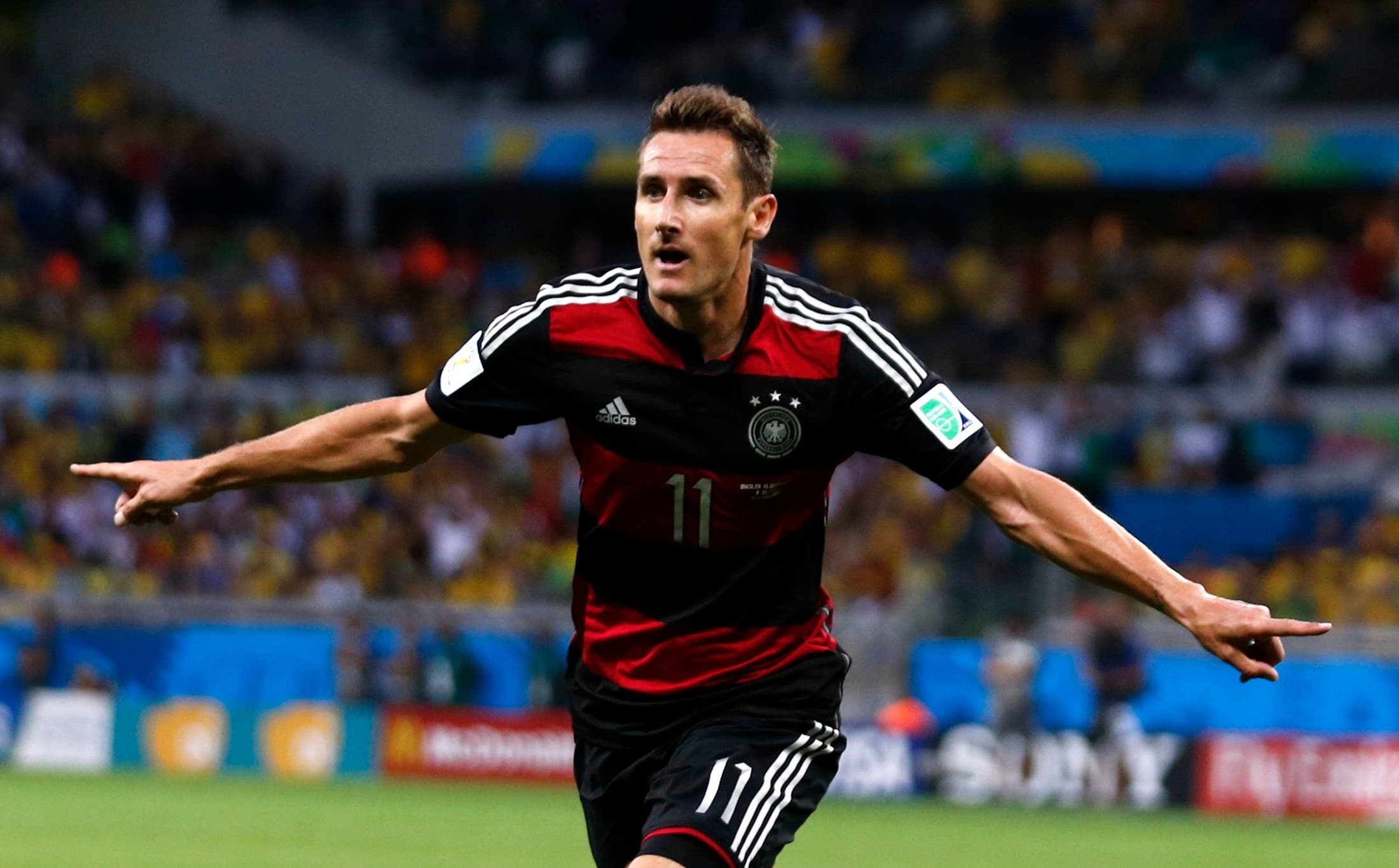 Germany's Miroslav Klose celebrates after scoring a goal during the 2014 World Cup semi-finals between Brazil and Germany at the Mineirao stadium in Belo Horizonte July 8, 2014. REUTERS/Marcos Brindicci (BRAZIL - Tags: TPX IMAGES OF THE DAY SOCCER SPORT WORLD CUP) TOPCUP